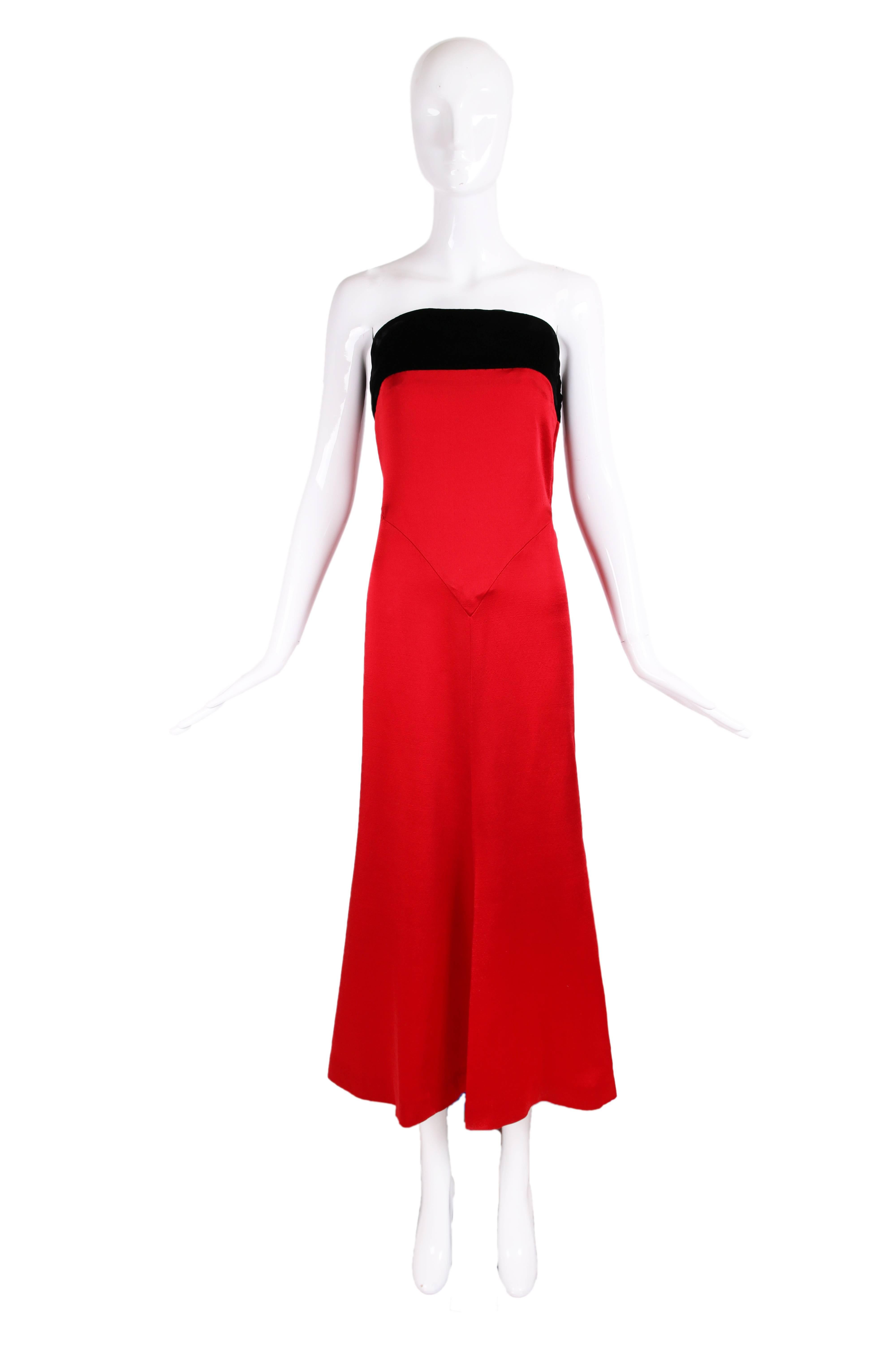 Yves Saint Laurent YSL red strapless gown with a black velvet band at the top of the bust. There is no fabric tag but fabric is silky with a satin sheen. Size tag 40 but dress appears to have been altered at the bust as well as the hem so please