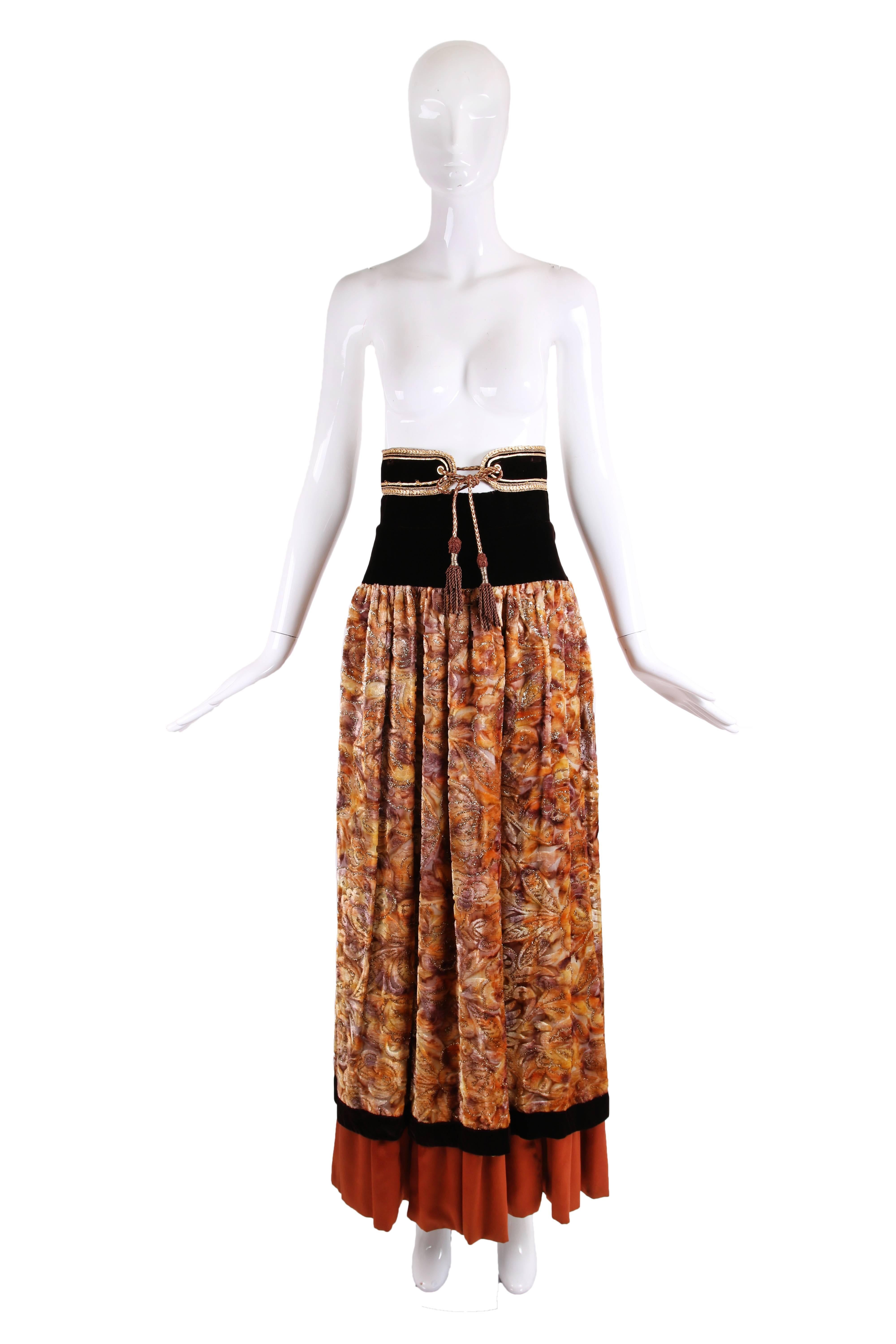 Inspired by Yves Saint Laurent (unlabeled) velvet burnout maxi skirt with a velvet waist band, gold metallic cord trim & waist ties and an interior layer of burnt orange fabric (feels like a silk blend) that pokes out at the hem. In good condition -