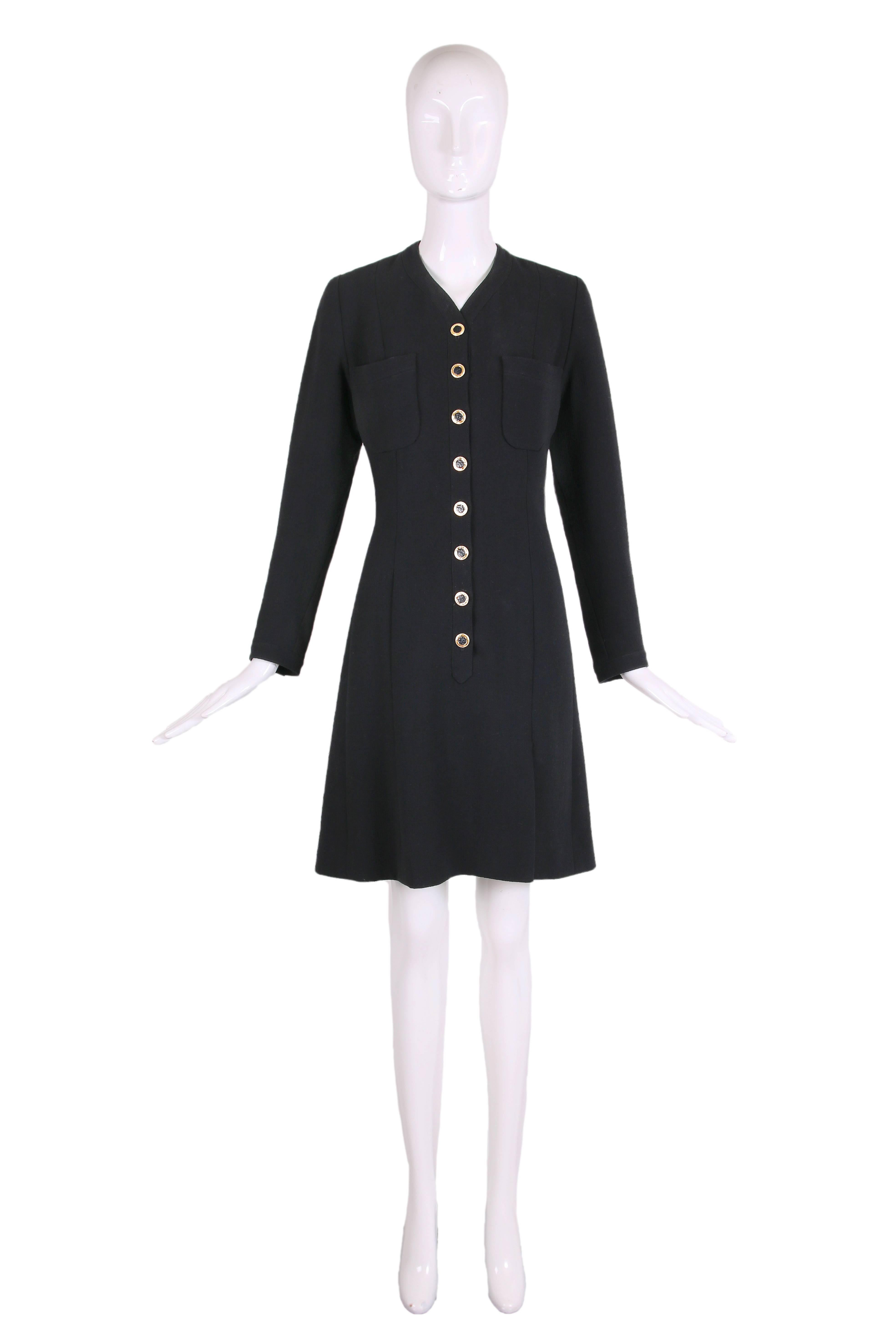 Full disclosure: this 1989 Chanel haute couture black wool crepe knee-length dress has zero rack appeal and photos do not do it justice. That said, I am here to tell you that it looks bananas on - welcome to the magic of Chanel! Dress features a