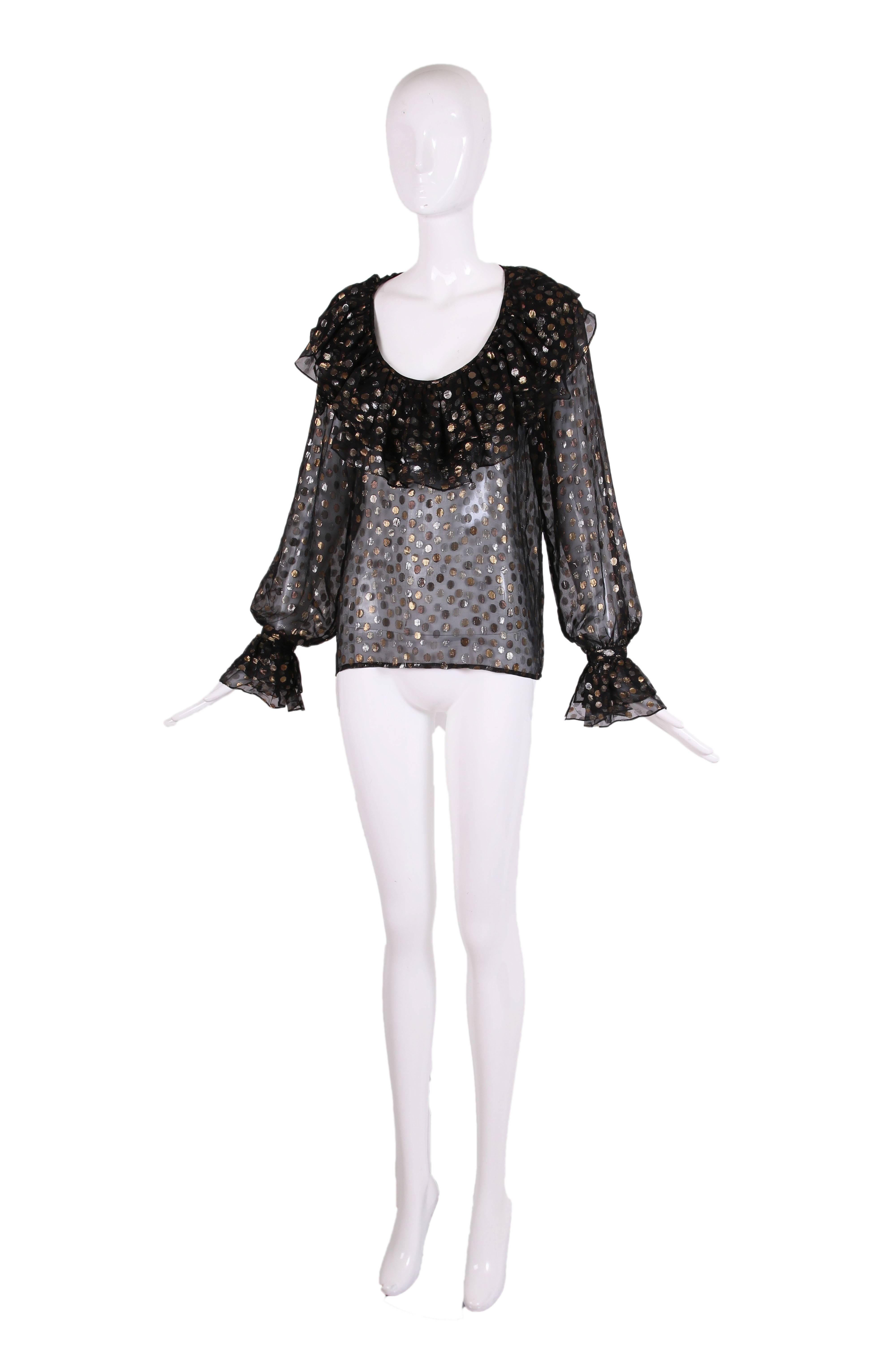 1970's Yves Saint Laurent black, silver & gold polka dot pattern transparent scoop neck blouse with ruffled neckline and cuffs. In excellent condition. Size tag 38.