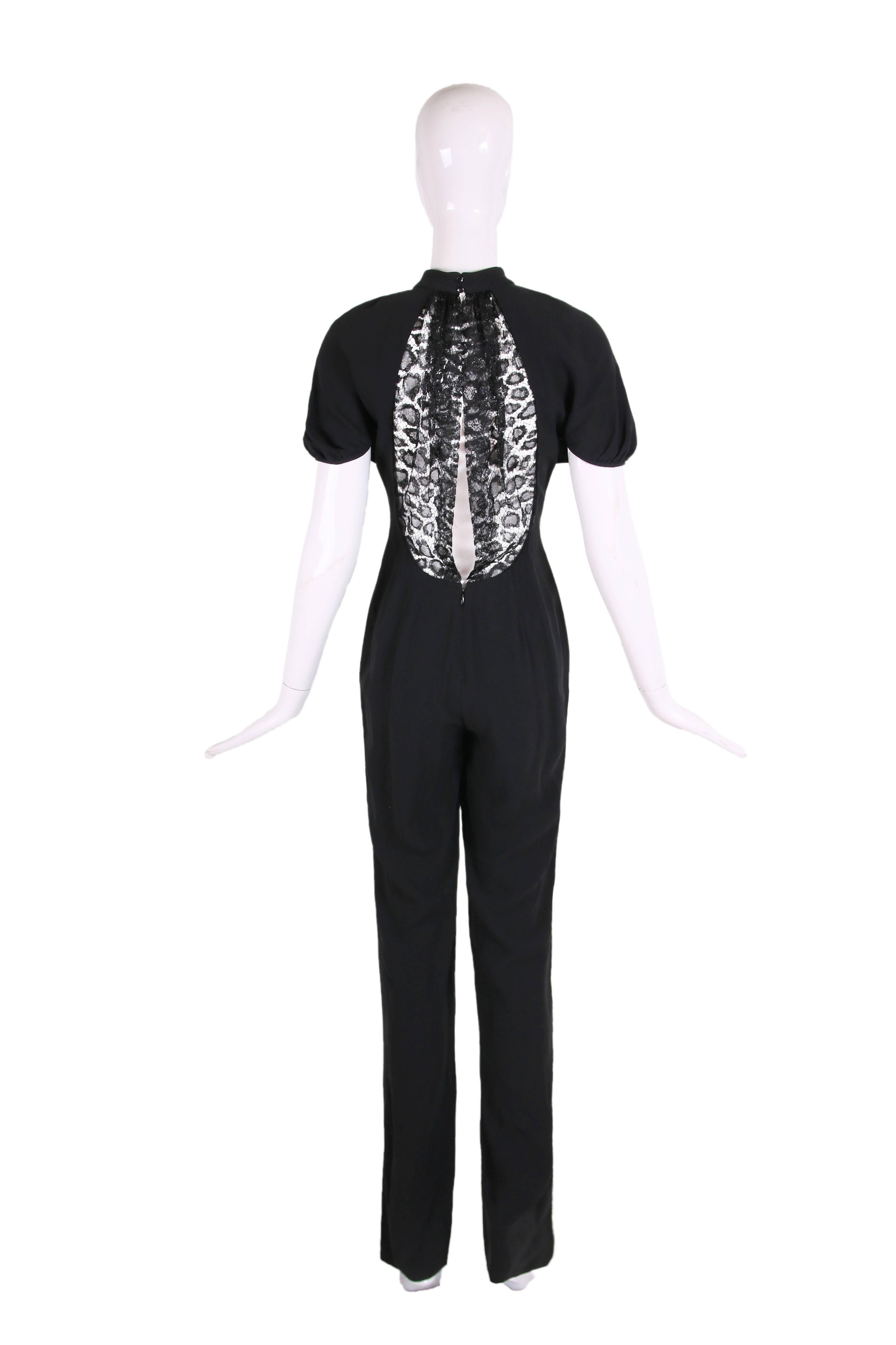 2012 Yves Saint Laurent black crepe jumpsuit w/shortsleeves and lace illusion panel at back. IN excellent condition - size 38.