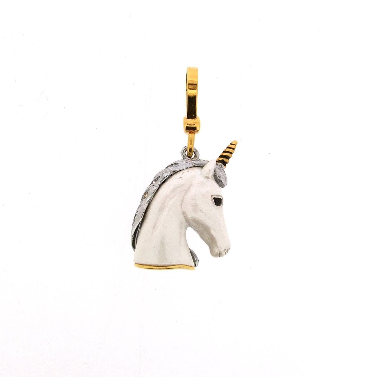 A stunning unicorn charm by Juicy Couture. Painted with glowing white moonglow enamel and set with a crystal encrusted silver tone mane and 14k gold plated lobster clasp. 

It measures 4.9cm from tip of loop to the bottom, 4cm from tip of horn to
