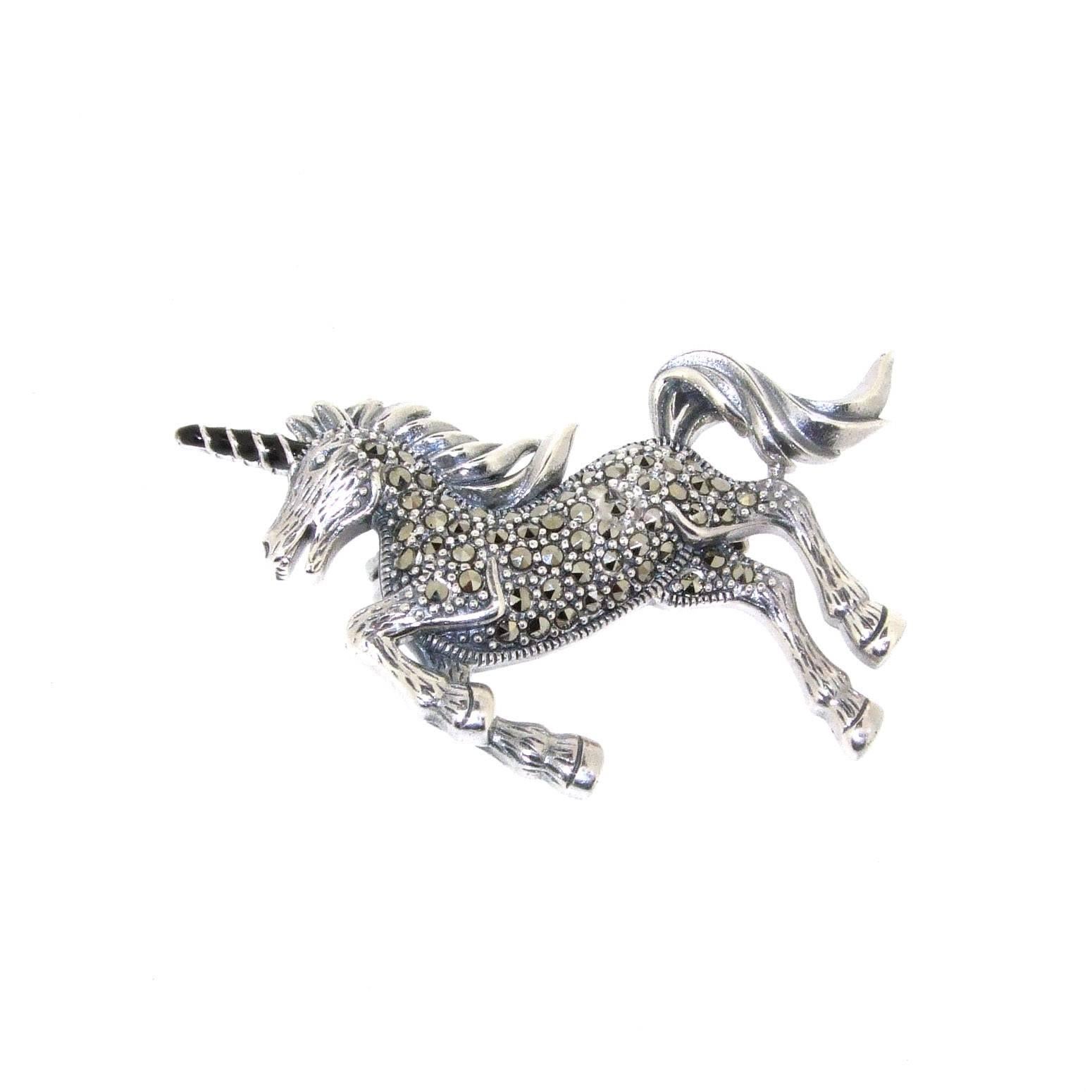 A sparkly unicorn brooch in sterling silver decorated with sparkling marcasites. There is a loop under the head so it can be worn as a pendant too.

It measures 4.5cm wide by 2.5cm high.

Our shop Hirst Antiques  is in London, Portobello Road. 