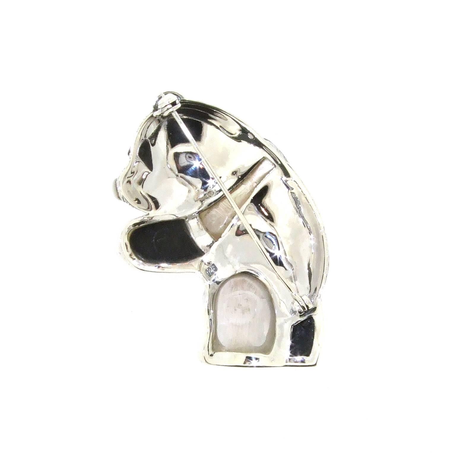 A new panda brooch made with black onyx and mother of pearl set in sterling silver and decorated with sparkling marcasites. 

It measures 6cm high by 3.8cm at the widest point.

Our shop Hirst Antiques is in London, Portobello Road.