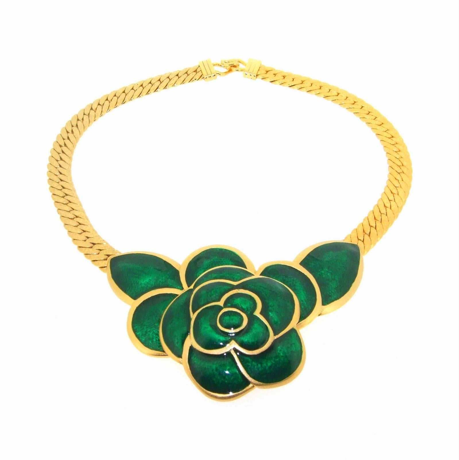 A beautiful necklace by Balenciaga with a central green enamel flower. 

The enamel section measures 3 1/2 inches(8.7cm) across. We also have the matching clip on earrings for sale in a separate listing.