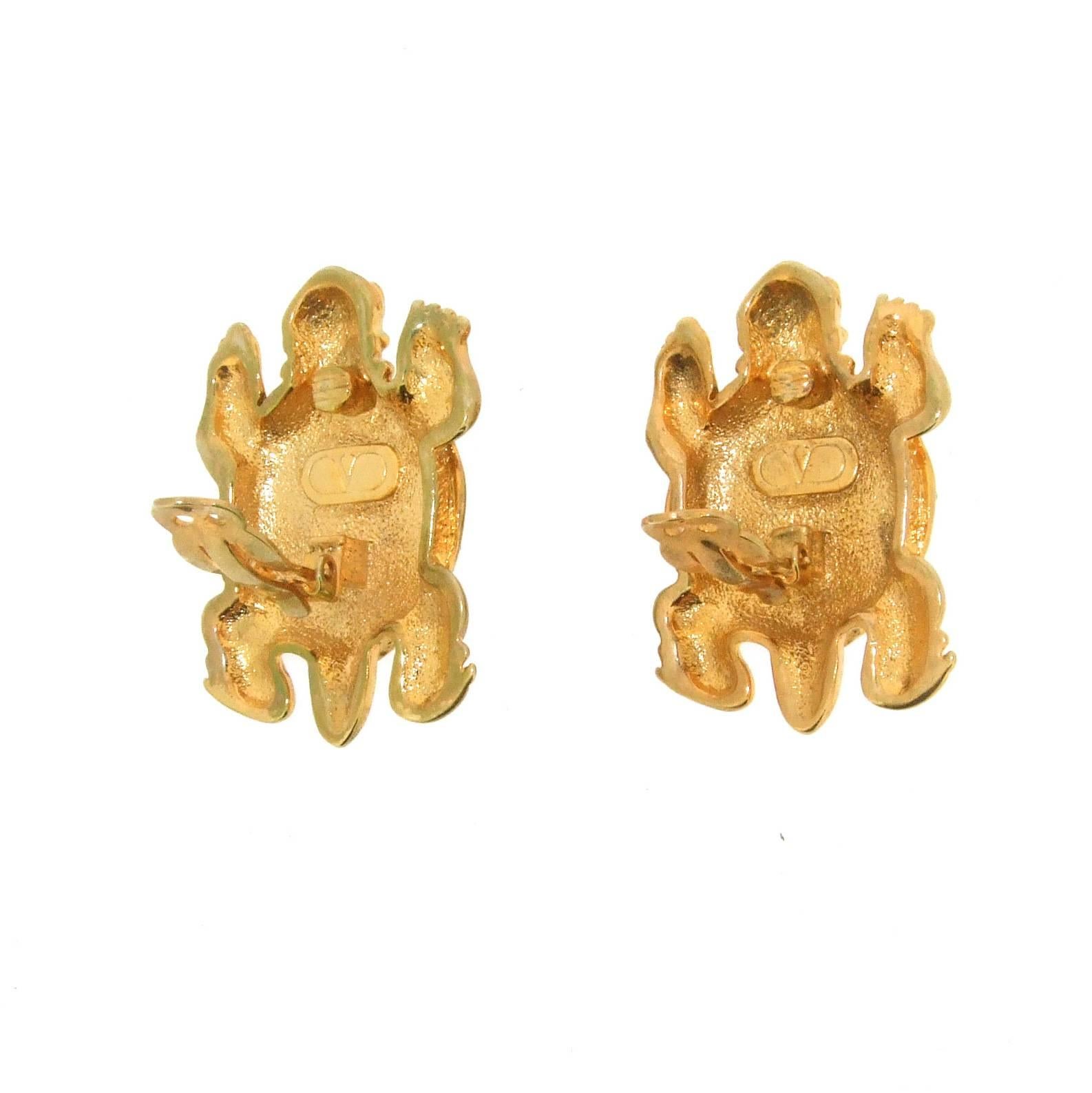 A fun pair of unique Vintage Valentino clip on earrings of a tortoise set in gold plated metal set with crystal. 