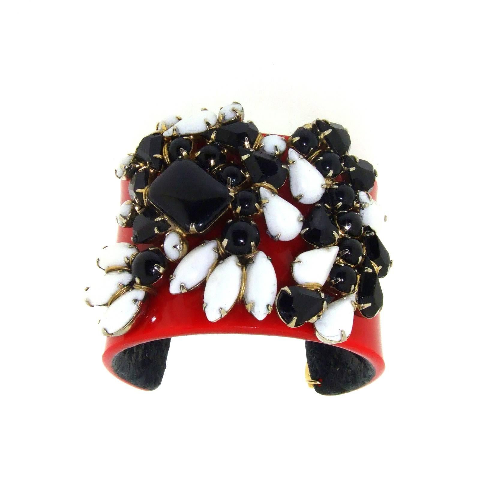 Ace Of Clubs: Black and white milk glass, matching swirl effect trio splashed upon blood red cuff with black leather lining. A unique cuff bracelet by Katherine Alexander London hand lined with leather.