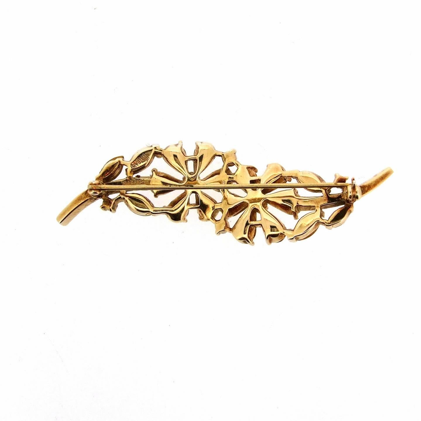 A beautiful floral three tone yellow citrine effect crystal brooch by Trfari accentuated with clear baguette stones. 

We also have the matching bracelet for sale.

Trifari was founded in the USA by Italian Gustavo Trifari in 1910. Chief