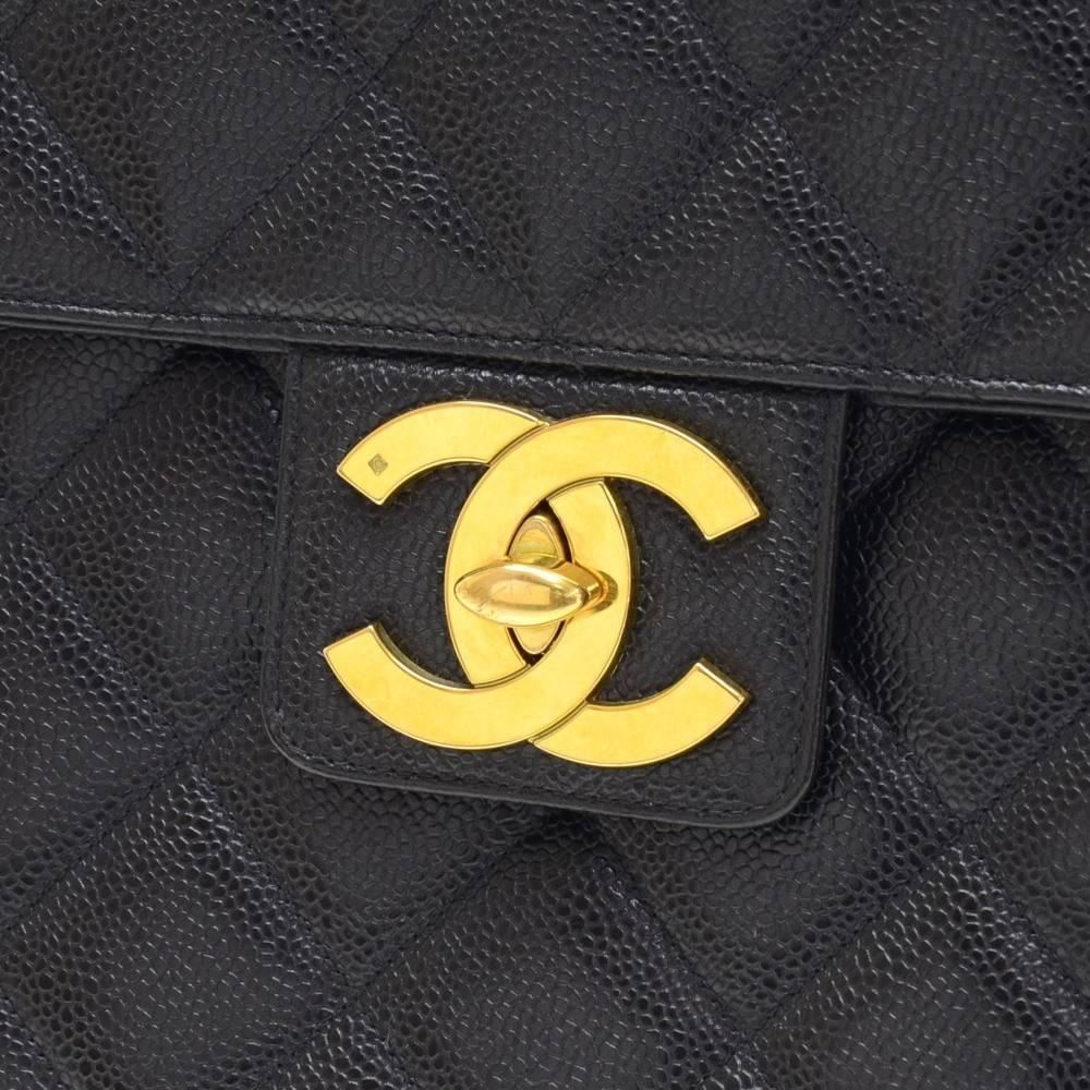 CURATOR'S NOTES

A timeless classic and forever statement bag: Vintage Chanel caviar leather briefcase featuring bold gold hardware.  Includes original Chanel dust bag and authenticity card. This gem is incredible priced and will sell