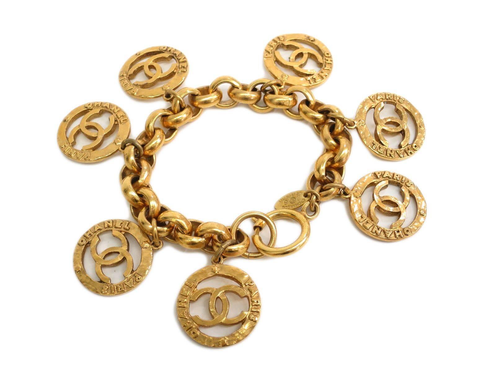 Chanel Gold Metal CC Logo Medallion Chain Link Charm Bangle Bracelet In Excellent Condition In Chicago, IL