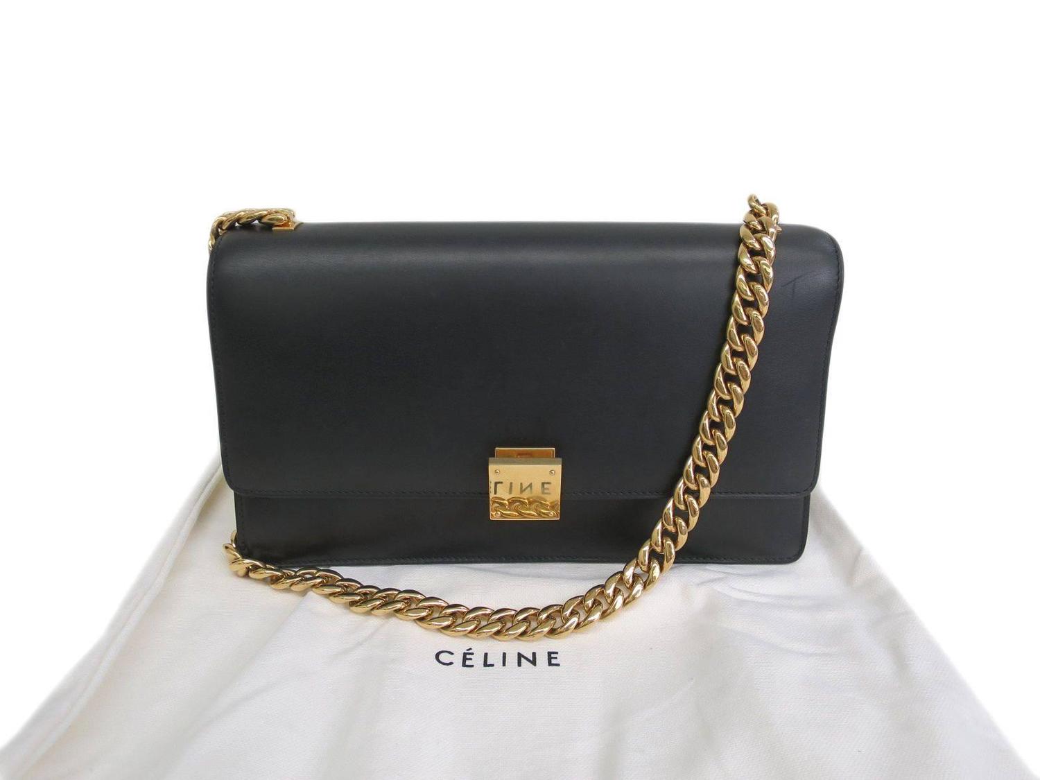 black shoulder bag with gold chain