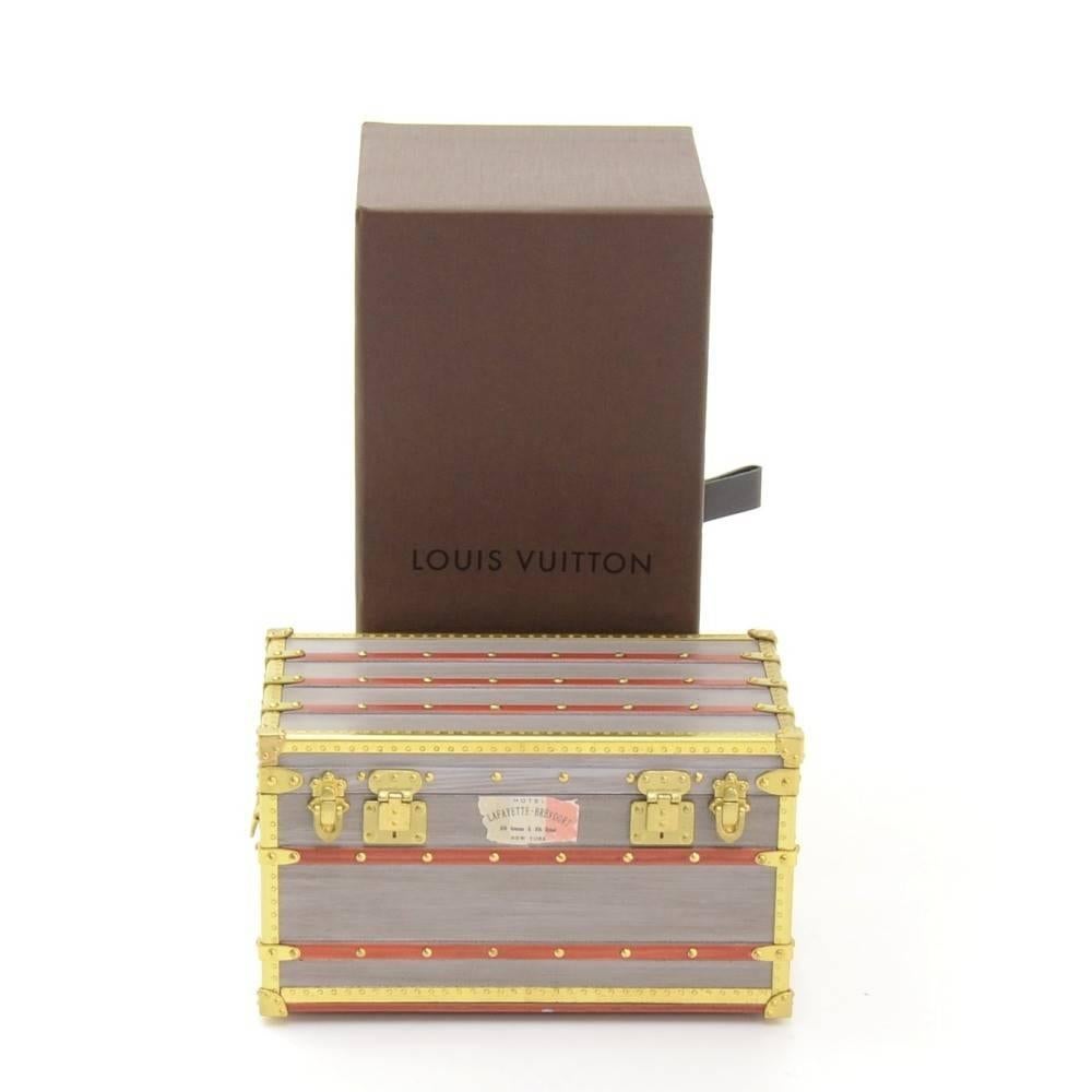 CURATOR'S NOTES

Louis Vuitton mini malle trunk VIP gift on the collection ceremony. The lid opens to reveal space to keep small treasures or jewelry.  Excellent for travel.

Made in France
Measures 4.3