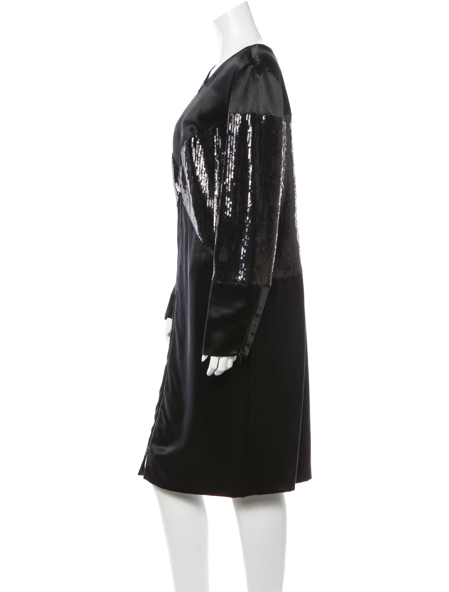 CURATOR'S NOTES

From the Fall 2010 Collection, this jaw-dropping Chanel satin midi dress boasts sequin accents, embellished CC buttons at waist, long sleeves and two-way front zip closure. 

If this is your size, do not miss your chance to own