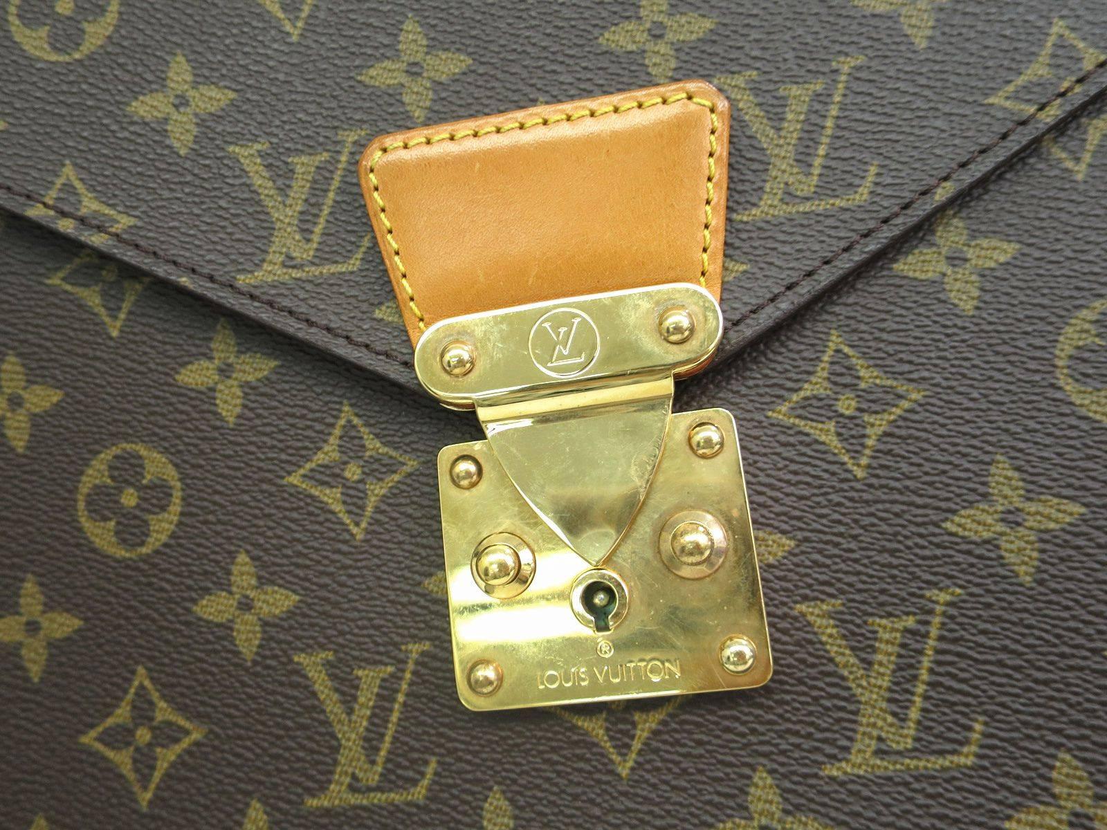 CURATOR'S NOTES

Monogram Canvas
Gold hardware
Slide lock closure
Made in France
Date code CT0960
Measures 14.2