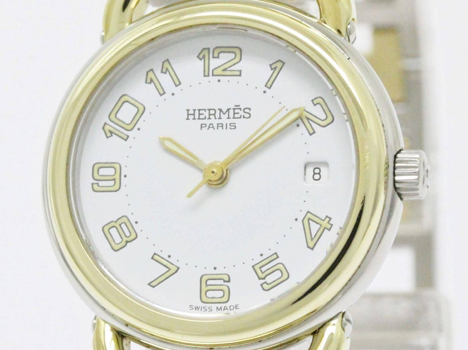 CURATOR'S NOTES

Stainless steel
Gold tone
Quartz movement
White dial
Date function
Case diameter 25mm 
Band size 6.7