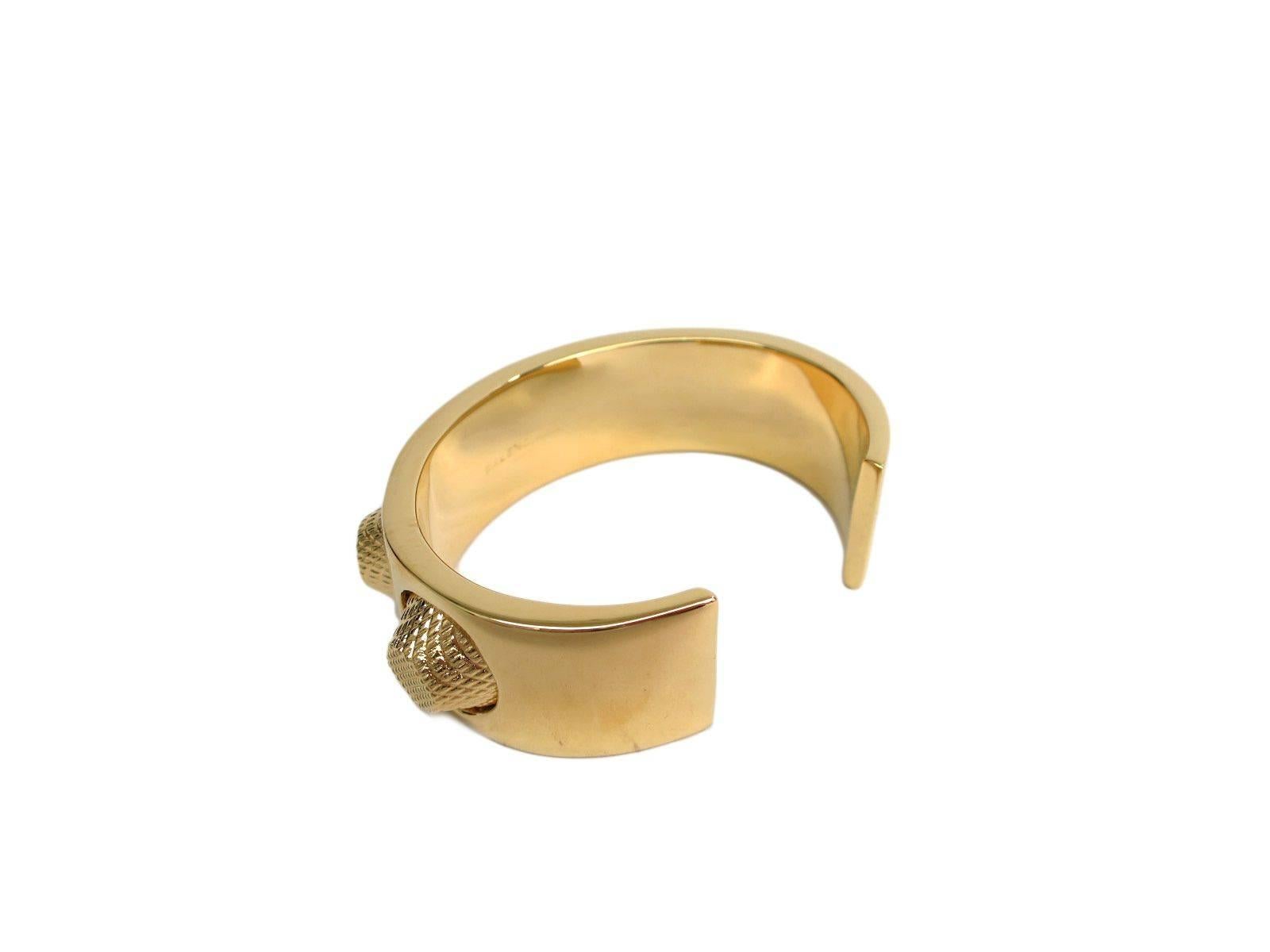 CURATOR'S NOTES

Balenciaga Textured Gold Spike Metal  Studded Charm Cuff Bracelet in Box  

Metal
Gold tone
Slip on
Width 0.8"
Circumference 6.7"
Includes original Balenciaga box