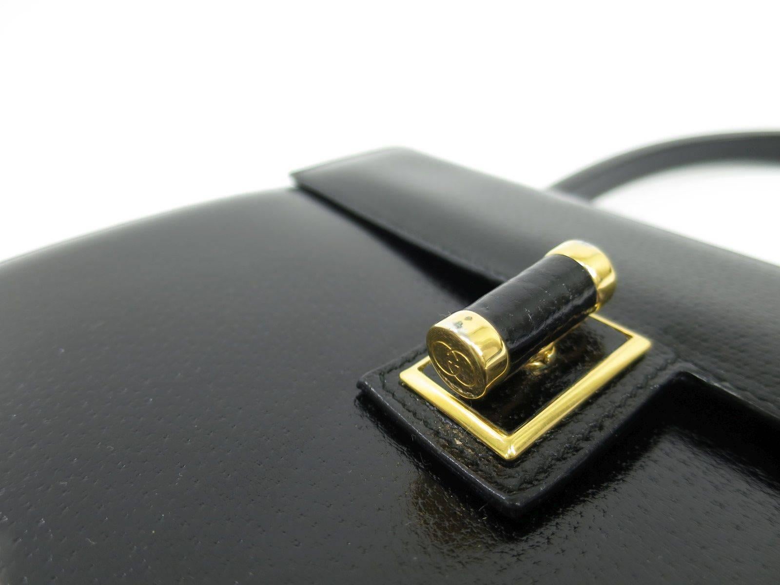 CURATOR'S NOTES

Jackie O would surely be jealous!  Rich black leather Gucci satchel bag featuring gold hardware and GG turnlock closure.  A true classic that will never go out of style.

Expecting a quick sale on this beauty.  Good