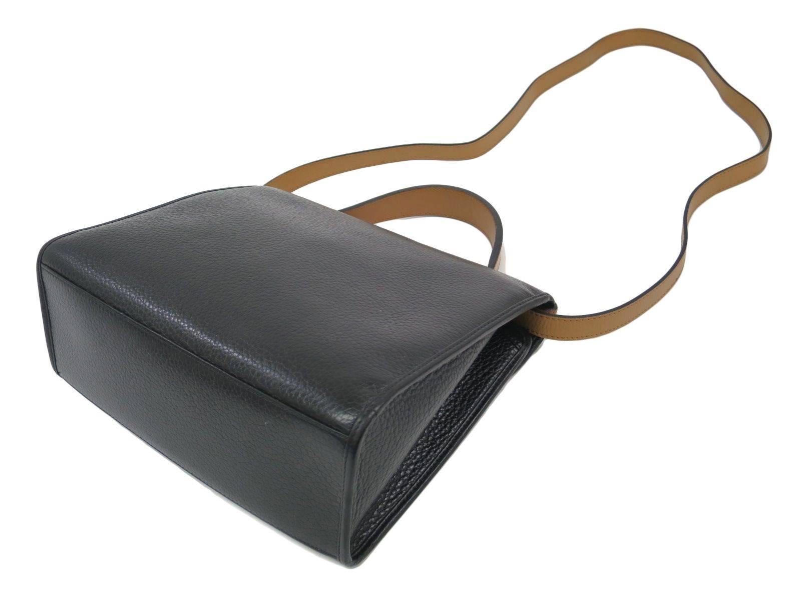 CURATOR'S NOTES  

Jackie O would surely be jealous! Rich two-tone black and beige leather Christian Dior satchel bag featuring gold hardware, CD logo and removable shoulder strap.  A true classic that will never go out of style. 