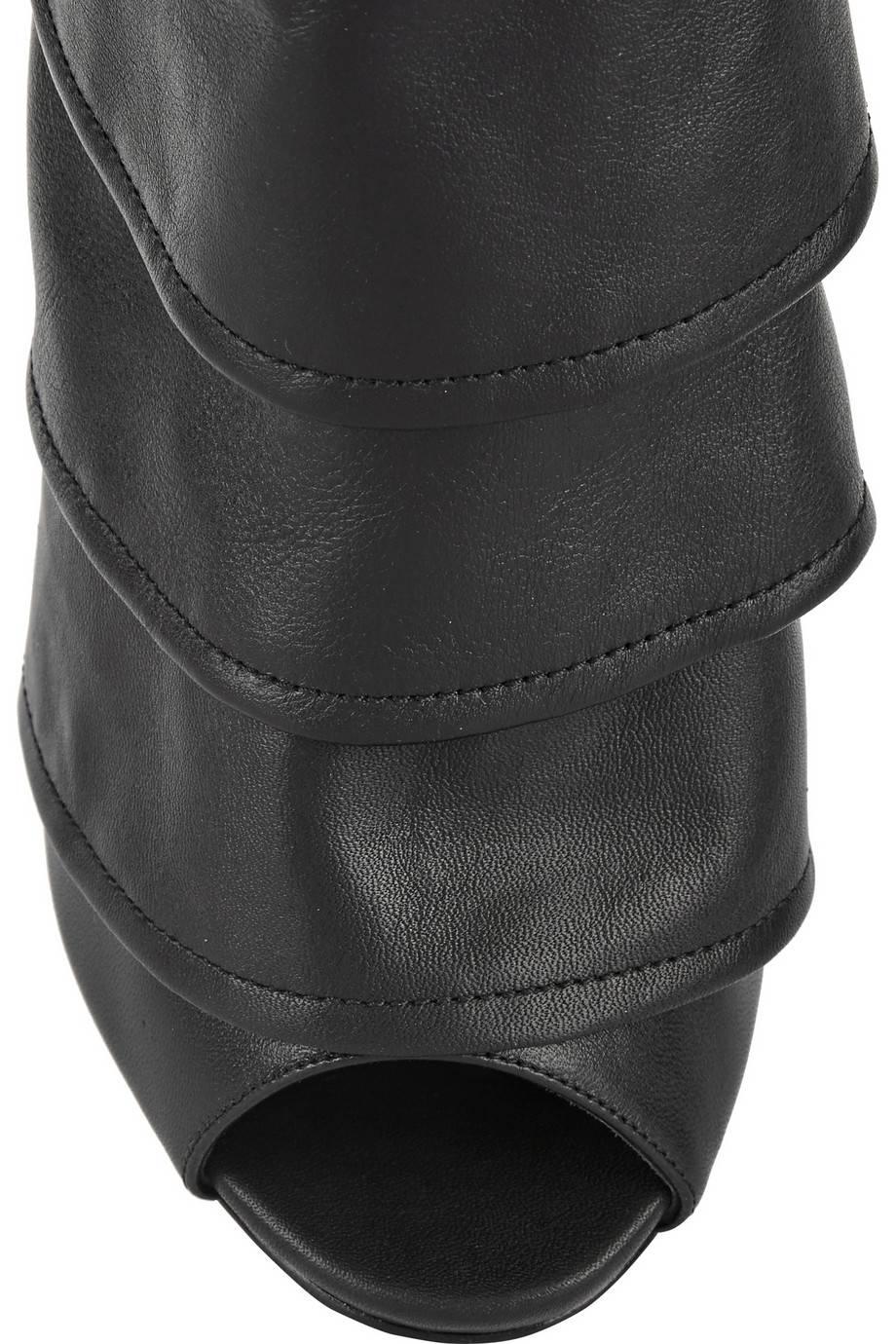 CURATOR'S NOTES

Size IT 36 (US 6)
Leather
Metal heel
Side zip, buckle closure
Made in Italy
Heel height 5.5