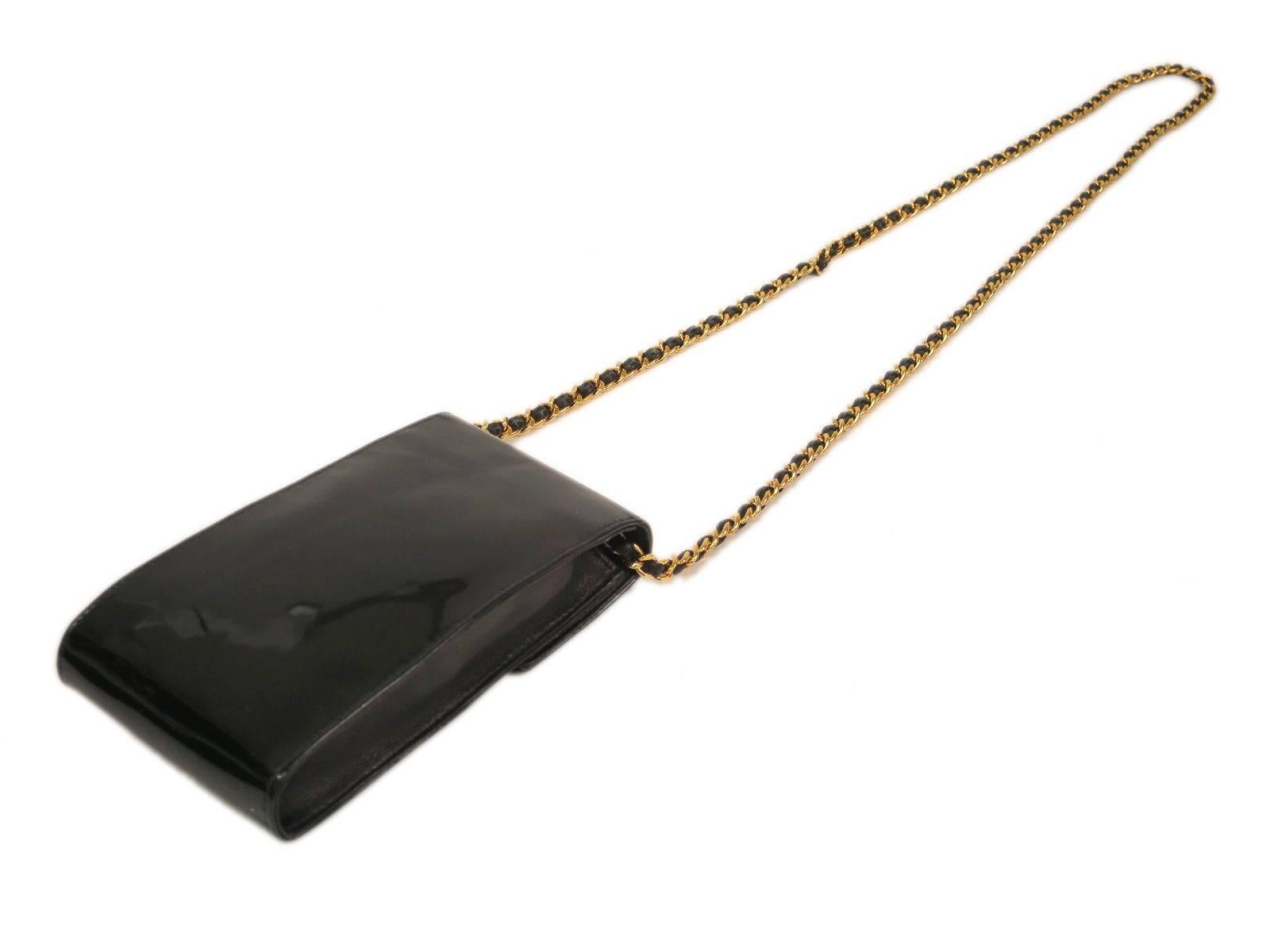 CURATOR'S NOTES

Whether for your cell phone or night out provisions, this mini Chanel patent leather chain shoulder bag will surely come in handy.

Style Tip: Rock it crossbody style or dangle it from your shoulder depending on your mood or