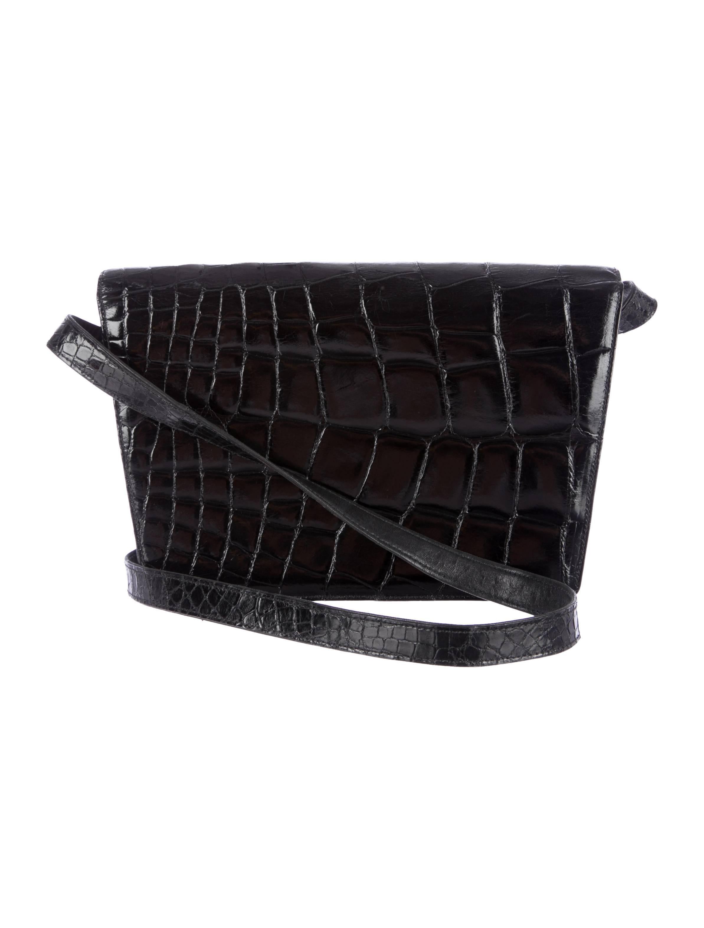 CURATOR'S NOTES

From the Tom Ford era, this black alligator Gucci bag is a modern classic.  

Style Tip: Tuck in the strap and rock this beautiful bag as an evening clutch for versatility!

Estimated value $7,000
Includes original dust