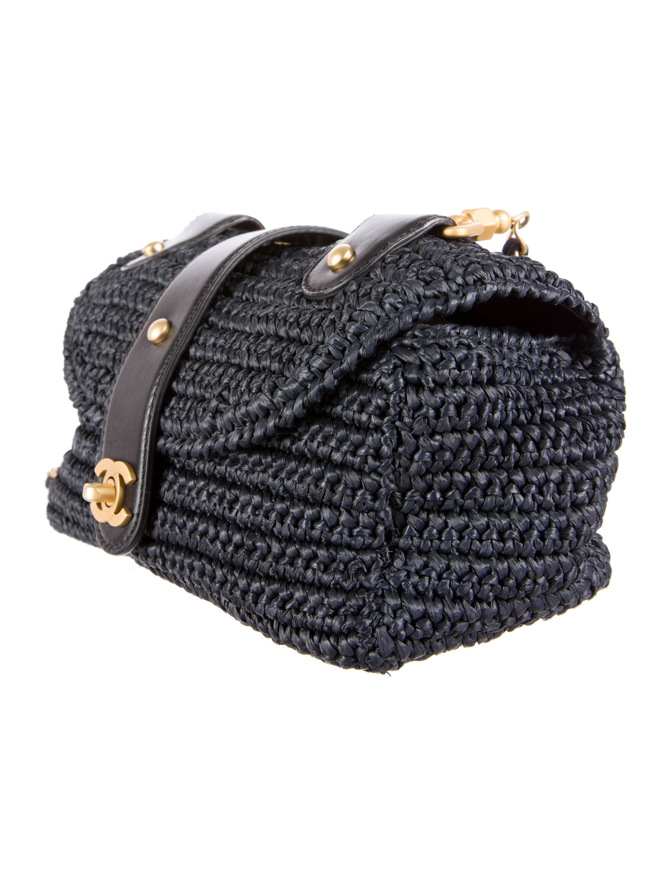 CURATOR'S NOTES

This unique Chanel straw raffia and leather flap shoulder bag is sure to garner compliments and stares.  Featuring leather accents, gold hardware and chain link shoulder strap, this is a must-have for any CoCo collector.

Straw