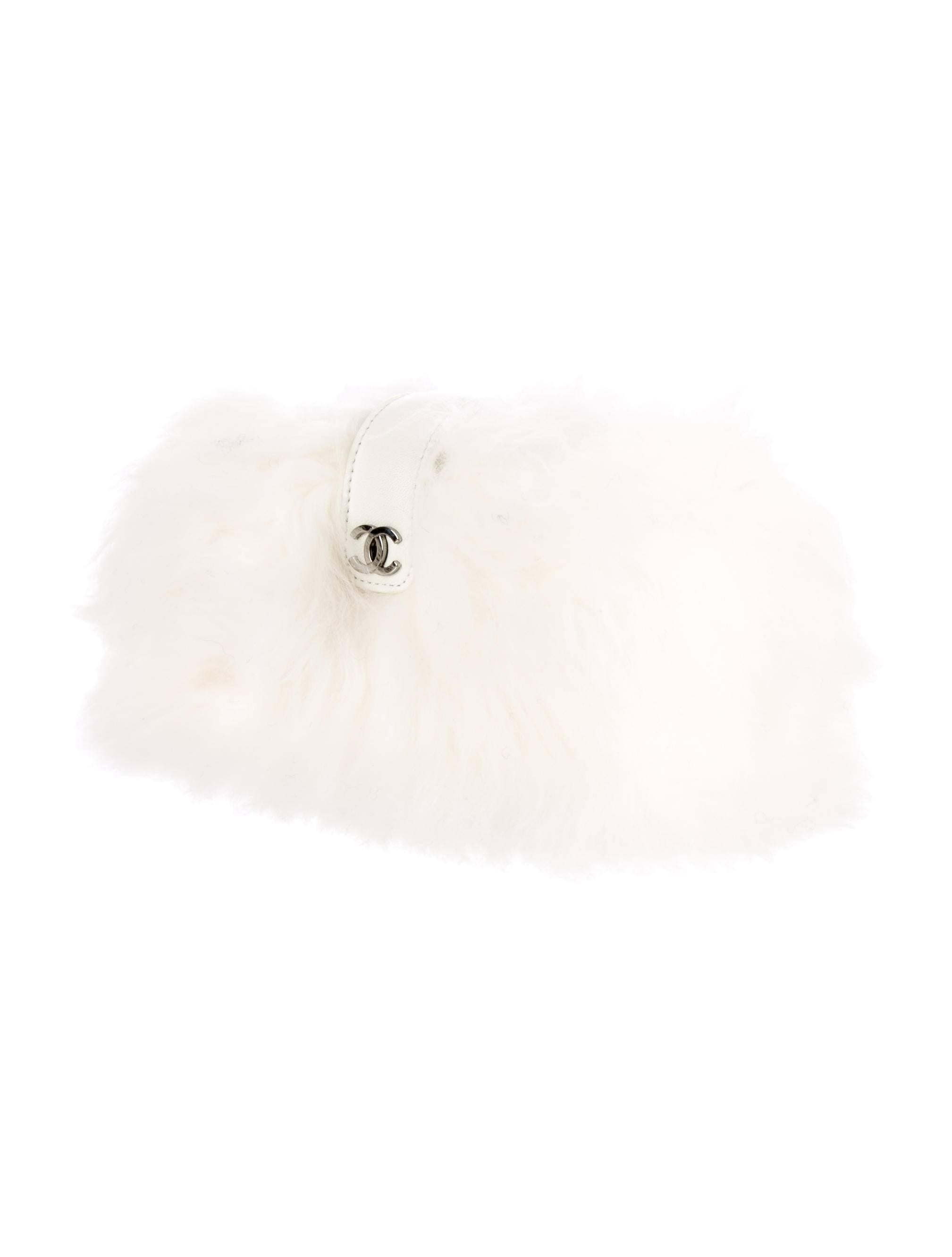 CURATOR'S NOTES

Incredibly beautiful and rare brand NEW Chanel white rabbit fur pearl chain shoulder bag. Includes original Chanel authenticity card and box making it the perfect gift!

Rabbit fur
Pearl chain strap
Gunmetal hardware
Suede