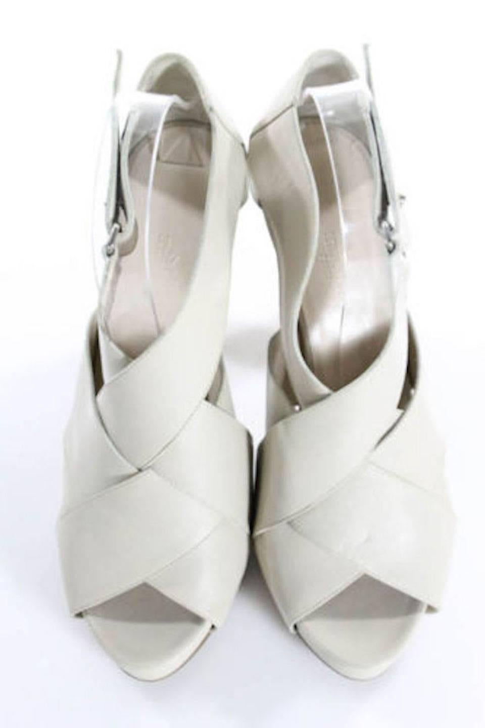 CURATOR'SNOTES

Size IT 40 (US 10) 
Leather
Silver hardware
Wooden heels
Made in Italy
Heel height 4.5