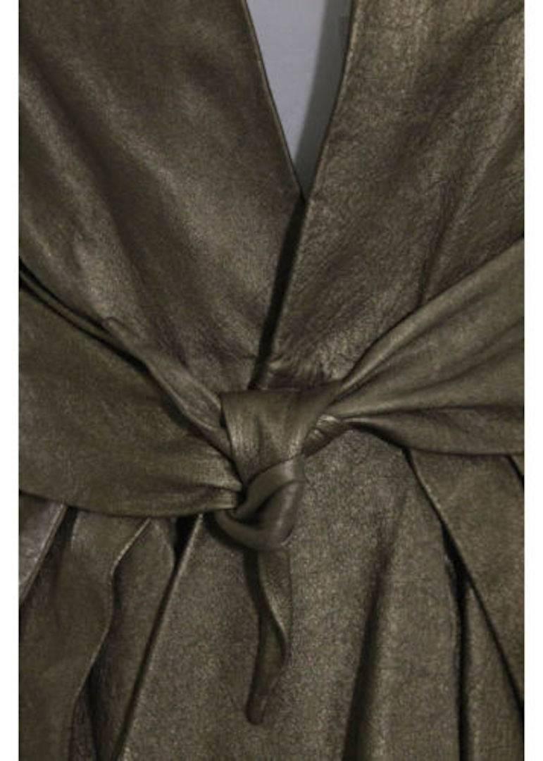 CURATOR'S NOTES

Stunning NEW Rick Owens blazer jacket featuring sumptuous bronze lambskin leather and built in belt at front. 

Size listed IT 44 (US 10)
Leather
Single button closure
Built in belt
Made in Italy
Bust 35