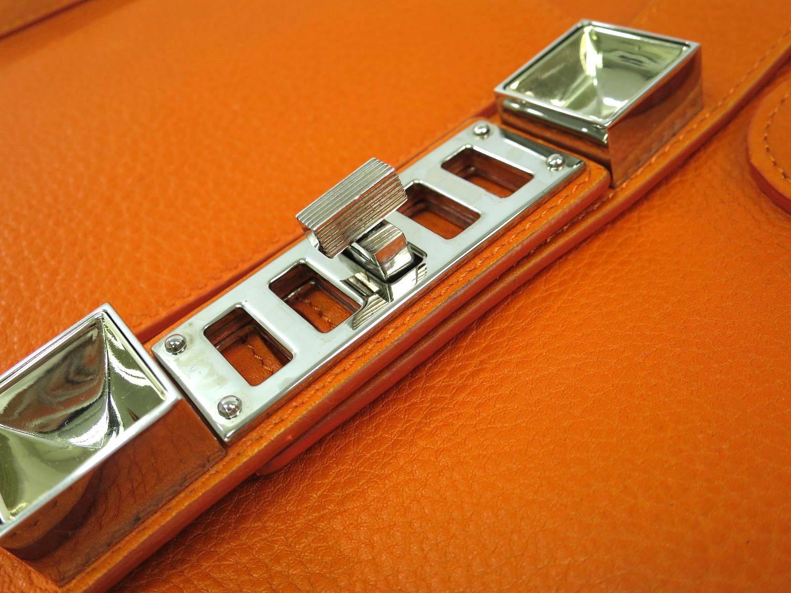 CURATOR'S NOTES

Proenza Schouler Orange Leather Gold Stud Hardware Satchel Tote Shoulder Bag  

Leather
Gold hardware
Hook closure
Made in Italy
Handle 14.5"
Measures 11.5" W x  11.8" H x 4.7" D
Adjustable shoulder strap