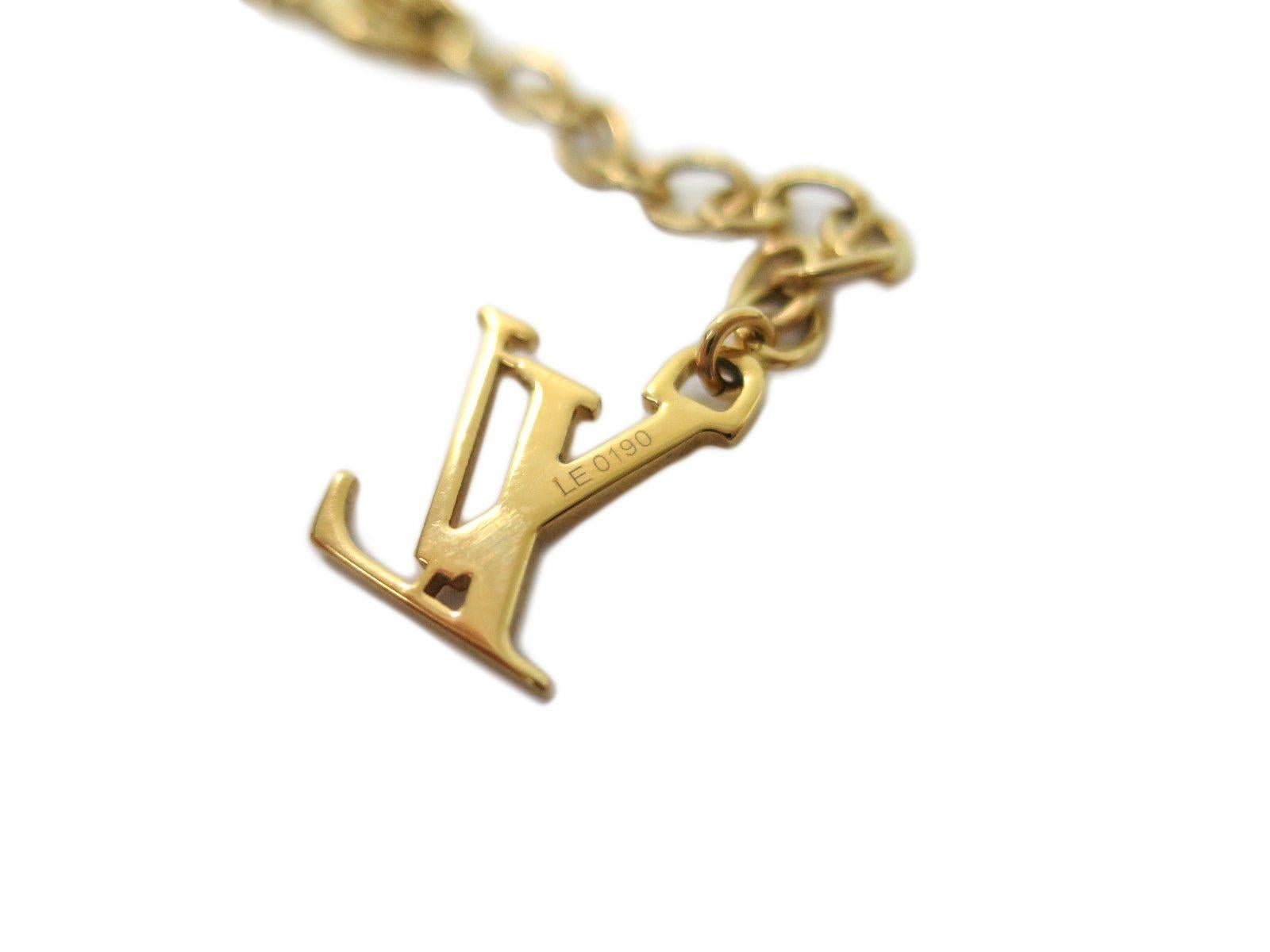 Louis Vuitton LIKE NEW Gold LV Flower Charms Chain Lariat Dangle Necklace in Box In Excellent Condition In Chicago, IL