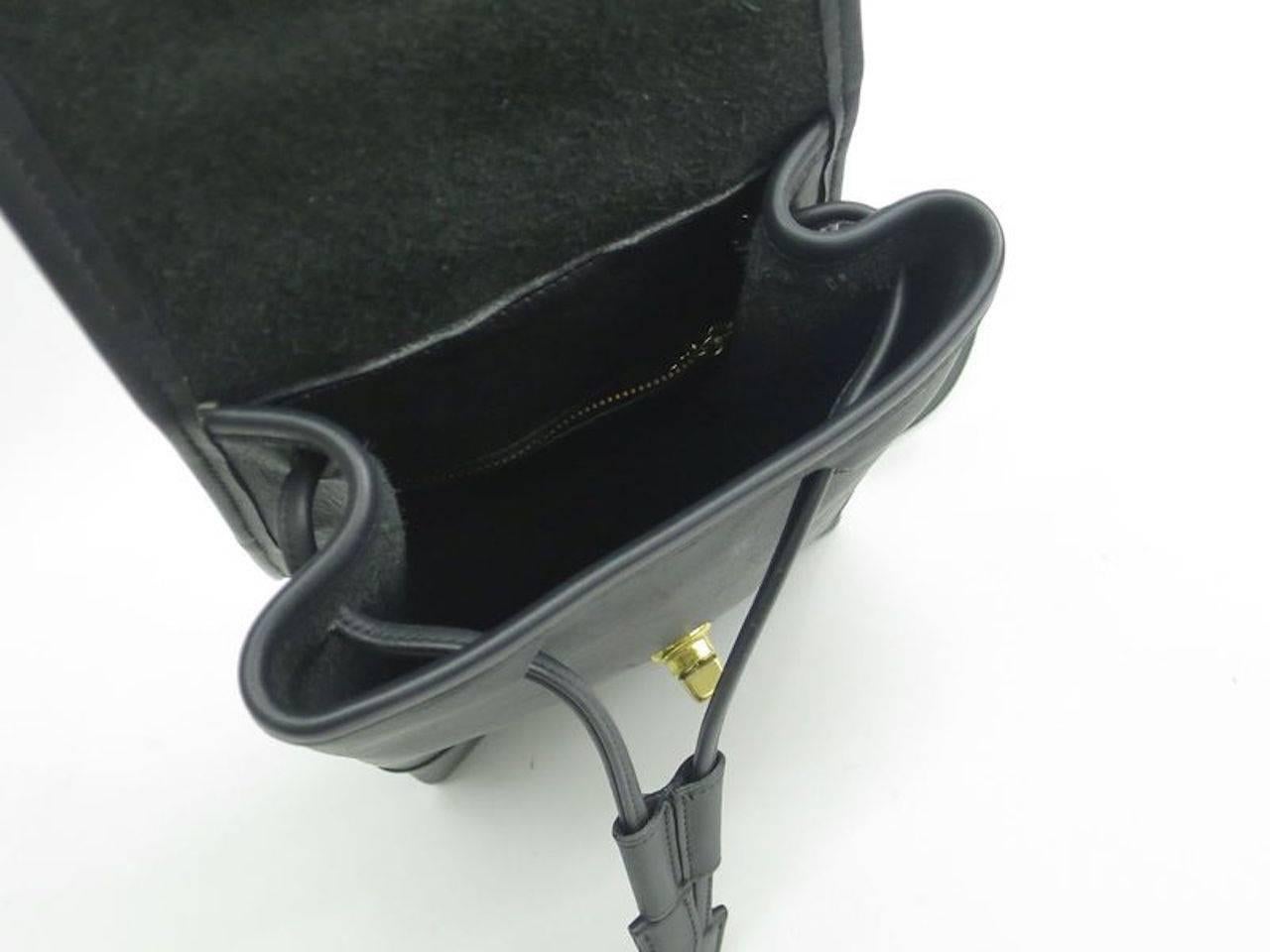 Coach Vintage Black Leather Gold Hardware Top Handle Flap Backpack In Good Condition In Chicago, IL