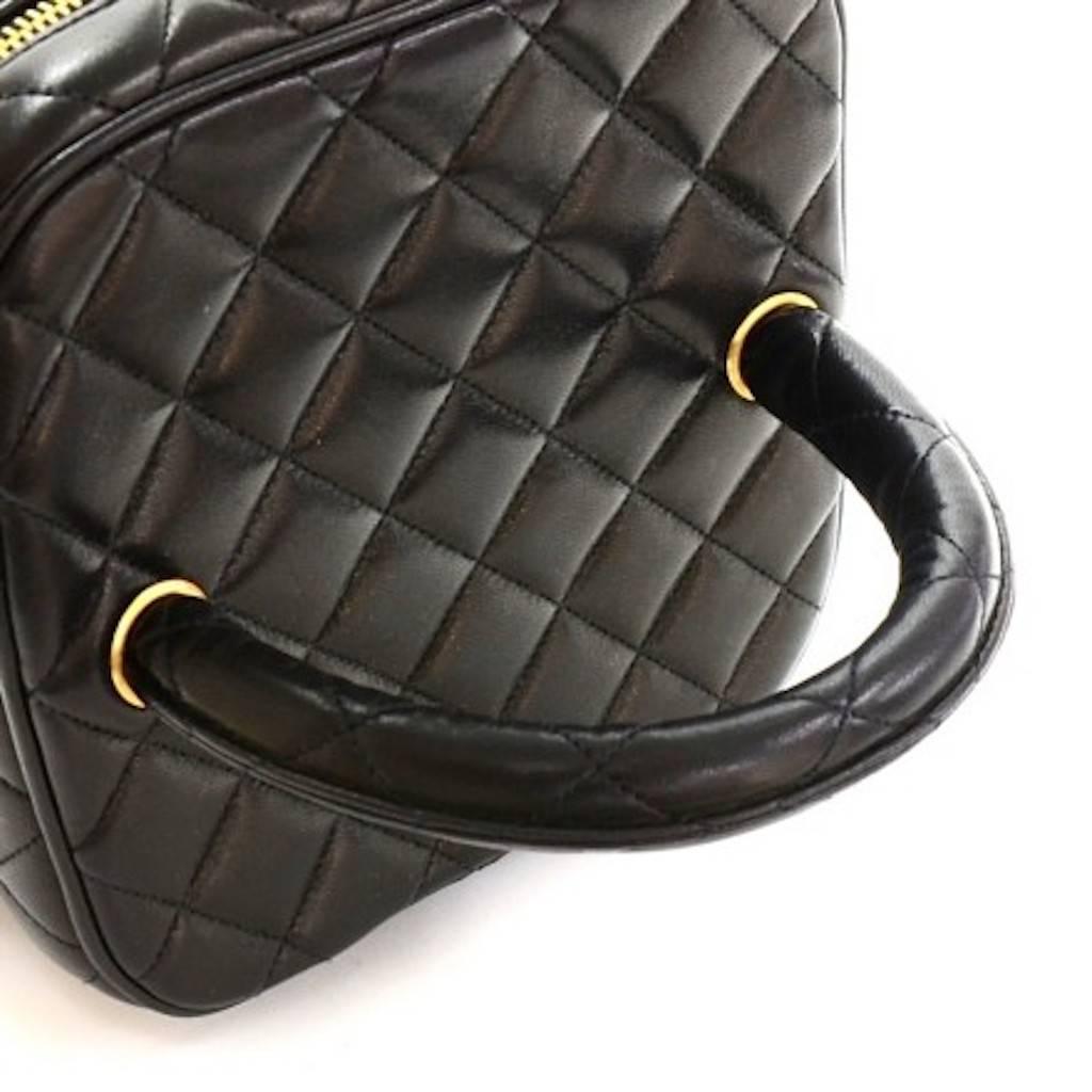 CURATOR'S NOTES

Chanel Vintage Black Lambskin Cosmetic Vanity Travel Evening Top Handle Bag  

Rock me as a handbag or sport me when traveling.  It's your world.

Lambskin leather
Gold hardware
Zipper closure 
Leather interior
Made in France
Handle