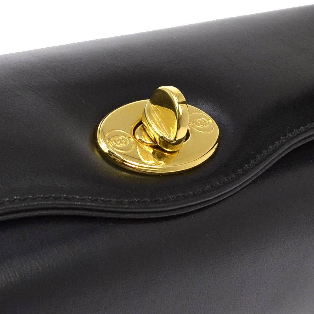CURATOR'S NOTES

Gucci Black Leather Gold Twist Lock Top Handle Satchel Bag  

Leather
Gold hardware
Twist lock closure
Made in Italy
Handle 6"
Measures 9.5" W x 7" H x 4" D