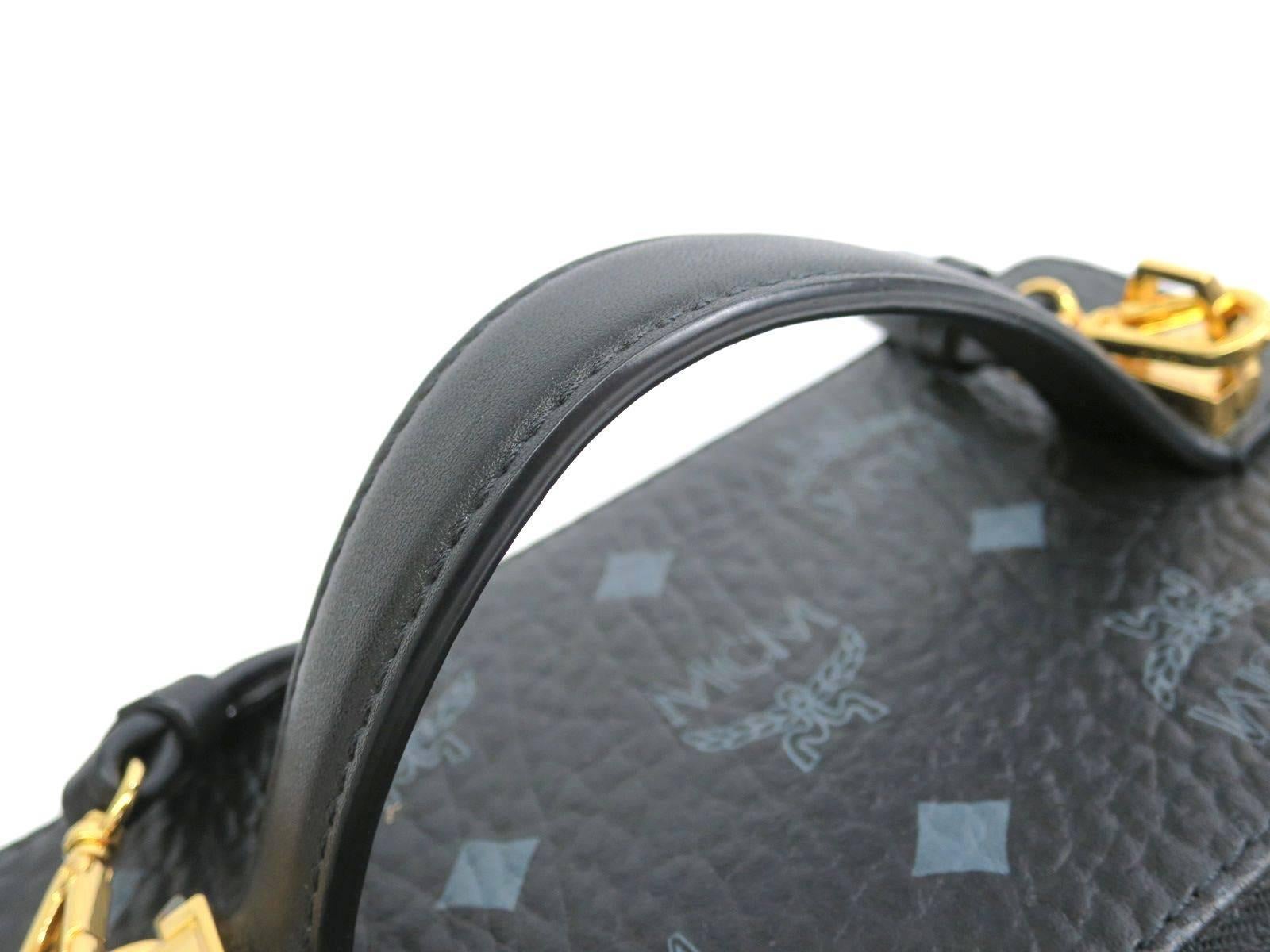 CURATOR'S NOTES

Leather
Monogram canvas
Gold tone hardware
Handle 6