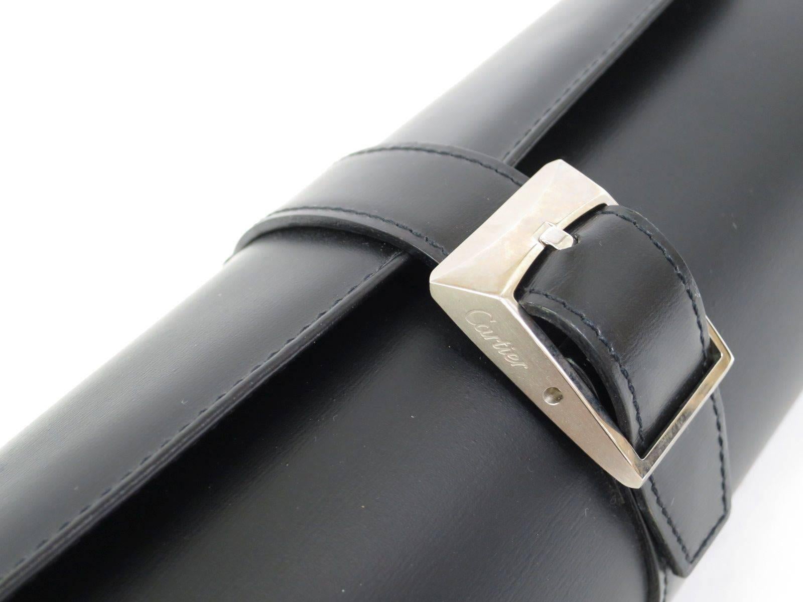 CURATOR'S NOTES

Cartier Black Leather Silver Hardware Travel Watch Storage Case Roll Bag  


Leather
Silver hardware
Velvet lining
Buckle closure
Measures 9" W x 3" H x 3" D 