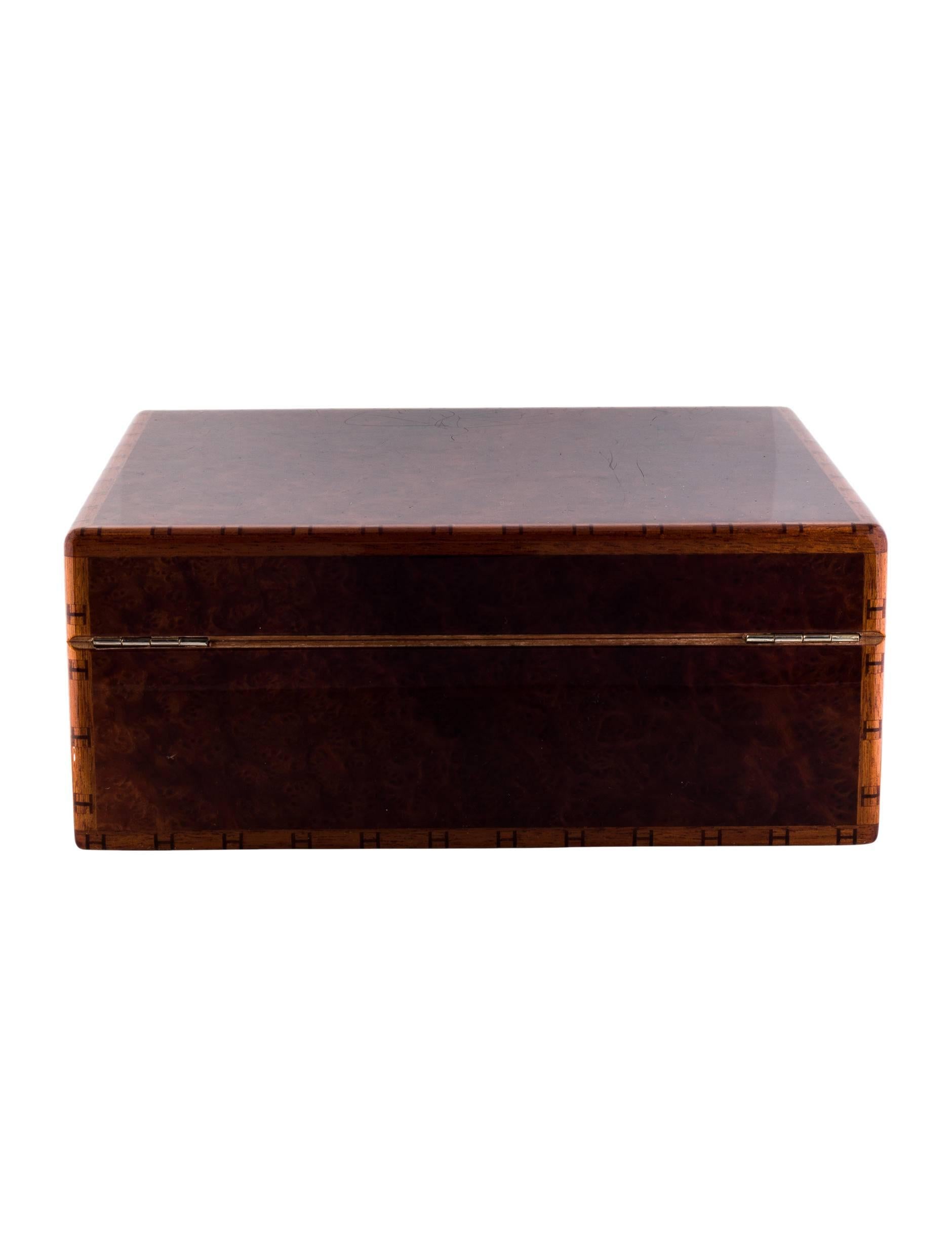 CURATOR'S NOTES

Put your cigar in this and smoke it!  Beautiful lacquer and wood Hermes cigar humidor featuring signature 'H' embellishments.  A timeless luxury gem for the man who loves his Cubans.  

Lacquer
Wood
Gold tone
Internal