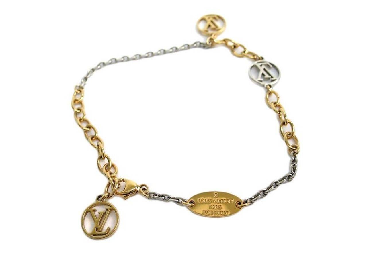 CURATOR'S NOTES

Louis Vuitton Mixed Metal LV Logo Chain Link Charm Bracelet in Box  

Metal
Gold tone
Silver tone
Lobster claw closure
Made in Italy
Charms measure 0.5"
Adjusts to fit wrist size ~6-7.5"
Includes original Louis Vuitton