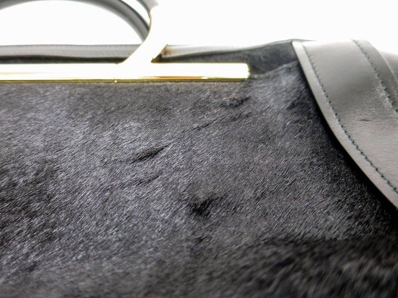 Salvatore Ferragamo Black Leather Gold Evening Top Handle Satchel Bag

Leather
Ponyhair fur
Zipper closure 
Made in Italy
Handle 13