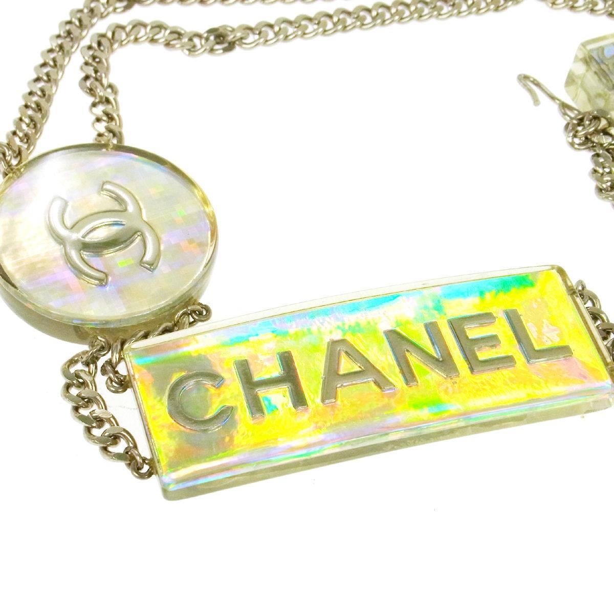 CURATOR'S NOTES

Sure to give any outfit a pop, this Chanel iridescent belt is a fun piece to add to your fashion repertoire.  Wear it as belt or necklace.  Your choice.

Metal
Silver tone
Iridescent accent
Hook closure
Made in France
CC