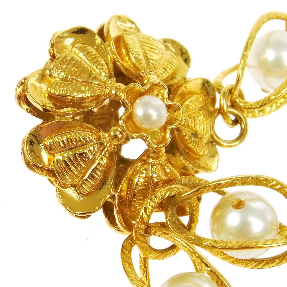 CURATOR'S NOTES

Metal
Gold tone
Faux pearl
Hook closure
Made in France
Width 0.5