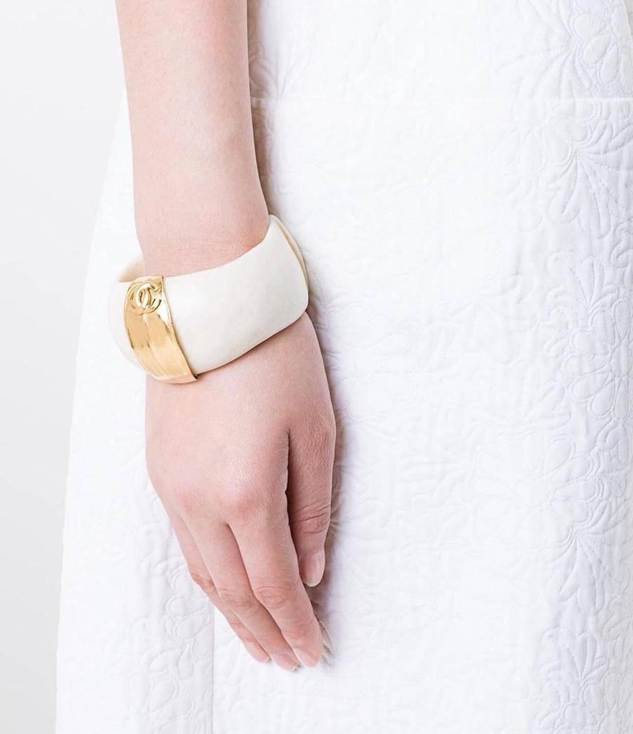 Chanel Rare Vintage Ivory Gold Charm Evening Cuff Bracelet 
Resin
Metal
Gold tone
Slip on 
Made in France
Width 1.5