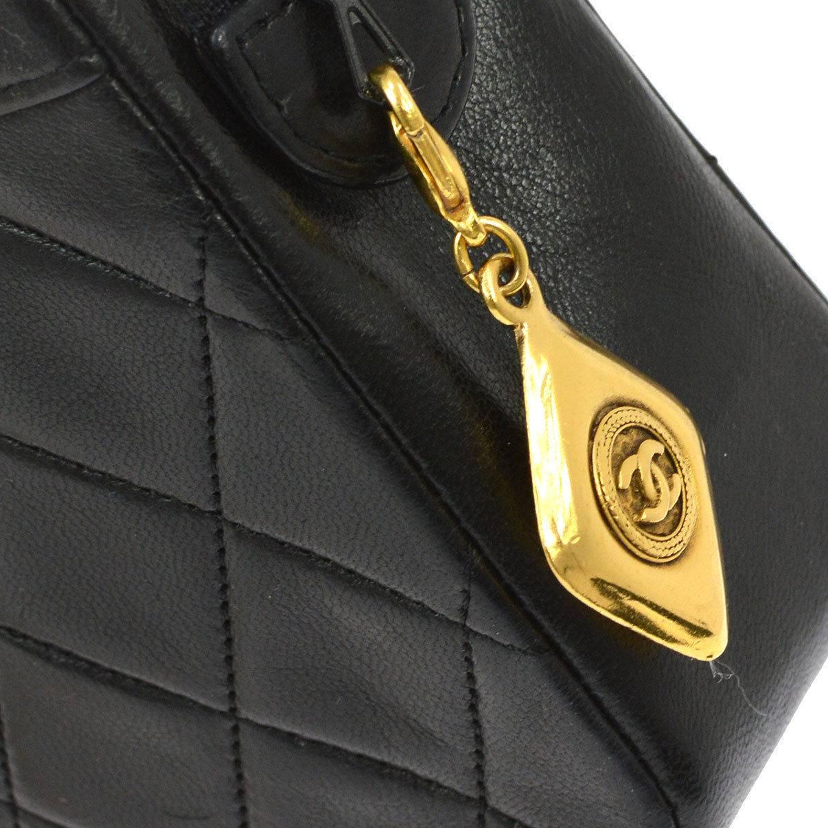 CURATOR'S NOTES

Chanel Black Lambskin Evening Top Handle Shoulder Bag .

Lambskin
Gold tone hardware
Zip closure
Date code 1279749
Made in France
Shoulder strap drop 9"
Measures 8" W x 6" H x 2" D 