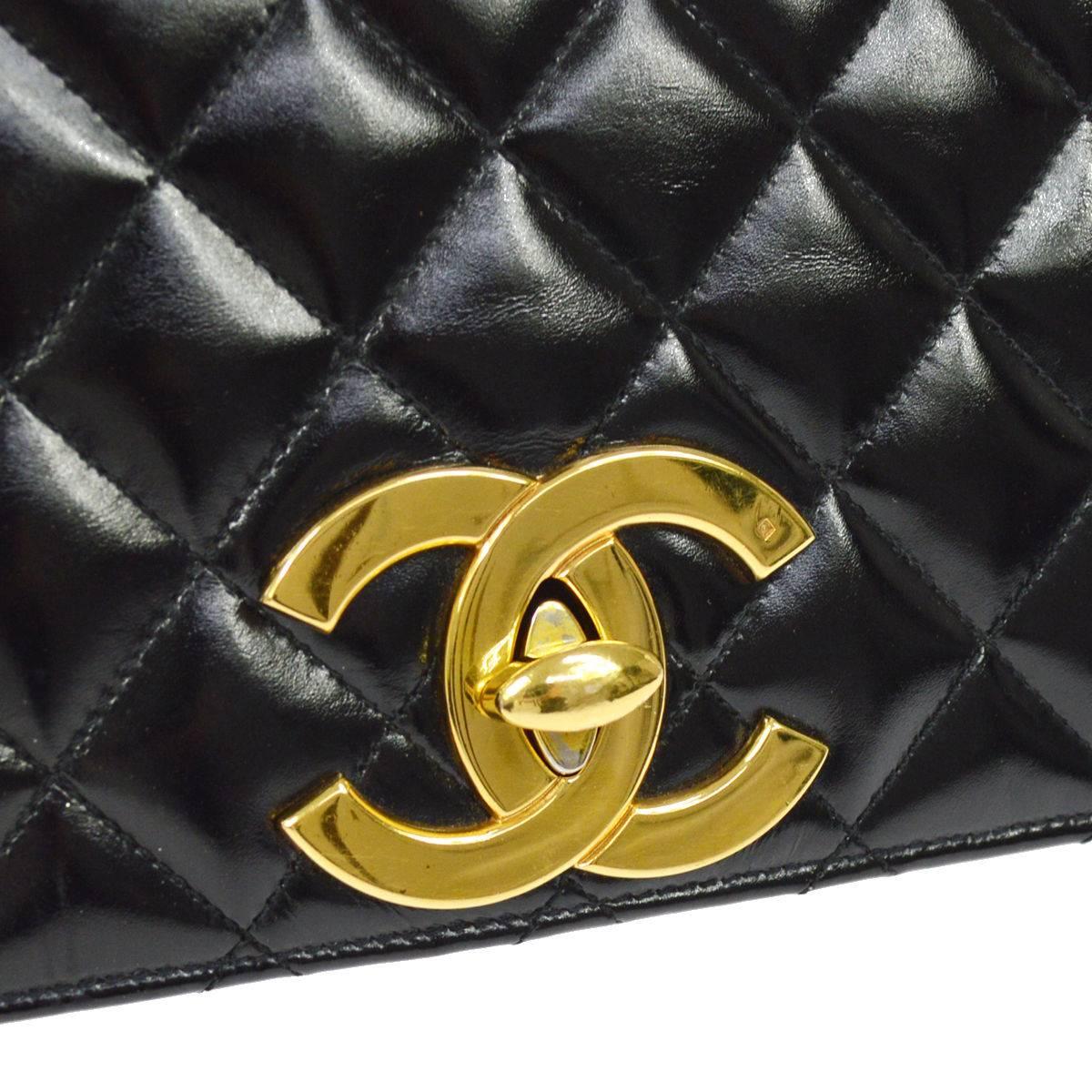 CURATOR'S NOTES

Chanel Vintage Rare Black Gold CC Charm Evening Small Flap Shoulder Bag  

Lambskin leather
Gold tone hardware
Turnlock closure
Leather interior
Date code
Made in France
Shoulder strap drop 20"
Measures 8.75" W x ×