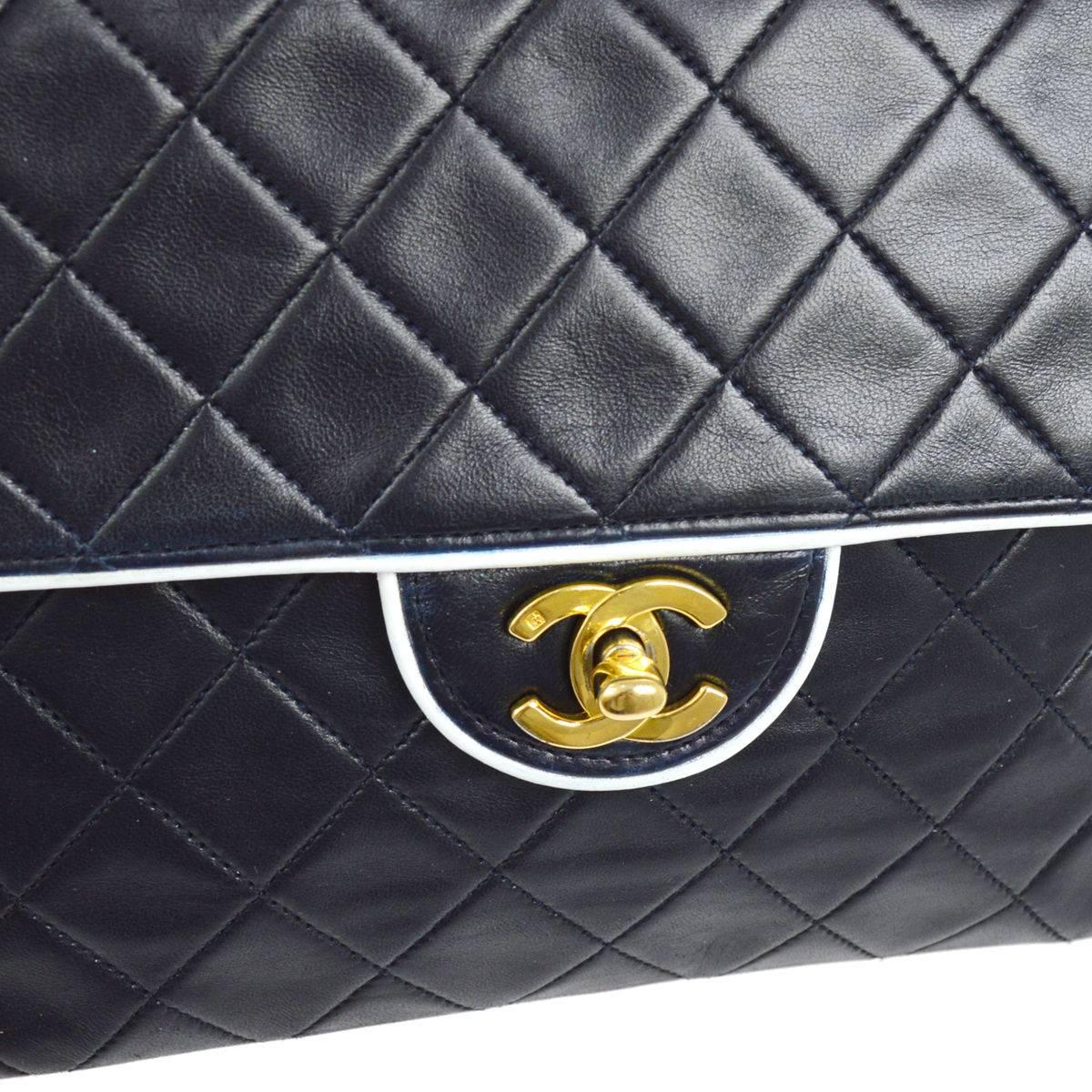 CURATOR'S NOTES

Chanel Vintage Two Tone White Piping Lambskin Leather Evening Clutch Flap Bag 

Style Tip: Wear this gorgeous Chanel as a single or double flap shoulder bag for ultimate versatility!

Lambskin
Gold tone hardware
Turnlock