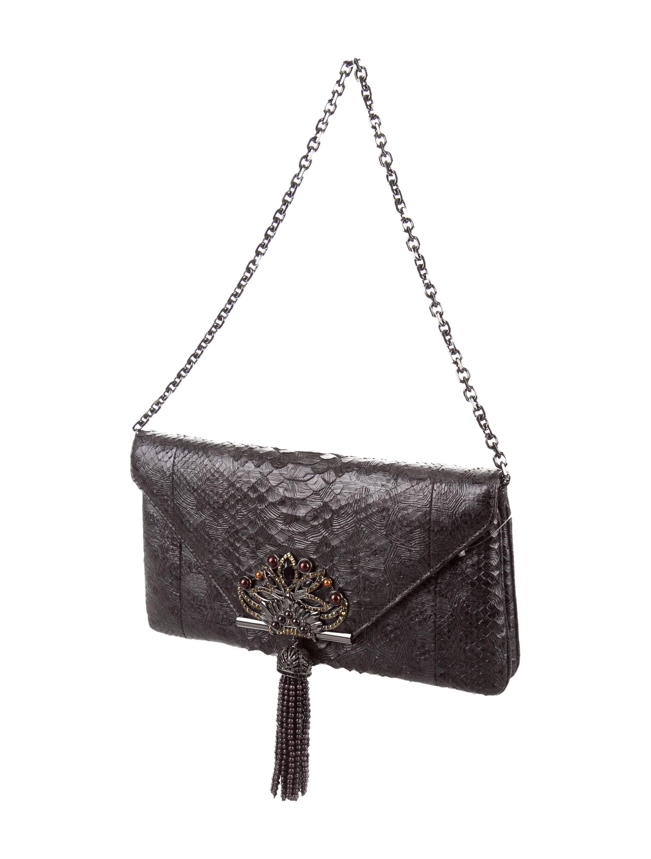 CURATOR'S NOTES

INCREDIBLY priced to sell. Simply stunning!

Original retail price $3,995
Python 
Gunmetal tone hardware
Bead and gem accents 
Satin lining
Magnetic snap closure 
Removable shoulder strap drop 8.5"
Measures 11.5" W x