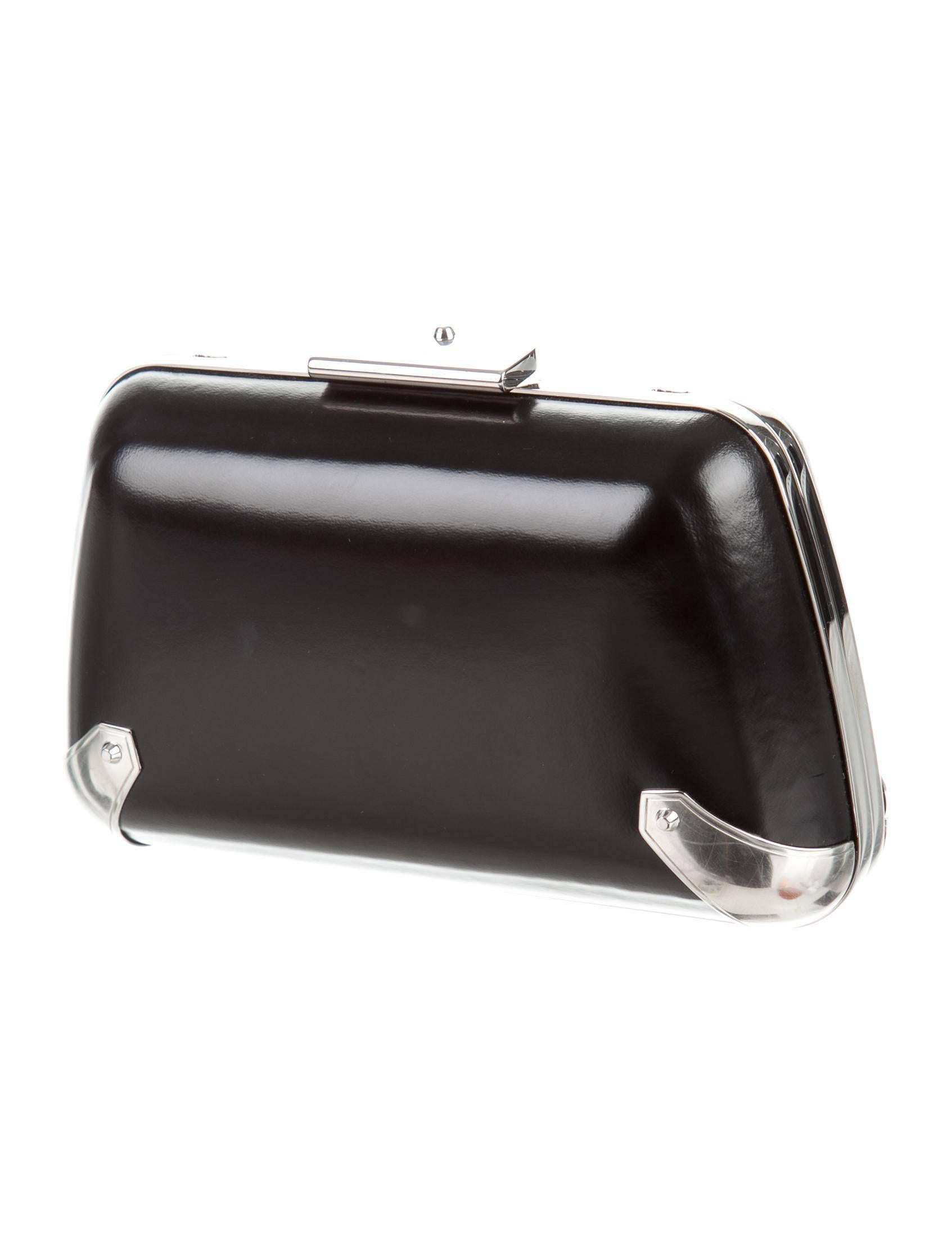 CURATOR'S NOTES

Balenciaga NEW Black Leather Silver Evening Pill Chain Shoulder Clutch Bag  

Leather
Silver tone hardware
Suede interior
Push lock closure 
Measures 6.5" W x 4.25" H x 2.25" D
Removable shoulder strap
