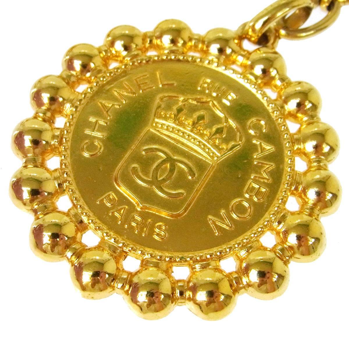 Chanel Vintage Gold Large Round Coin Charm Rue Cambon Pendant Evening Necklace

Metal
Gold tone
Lobster claw closure
Charm diameter 3