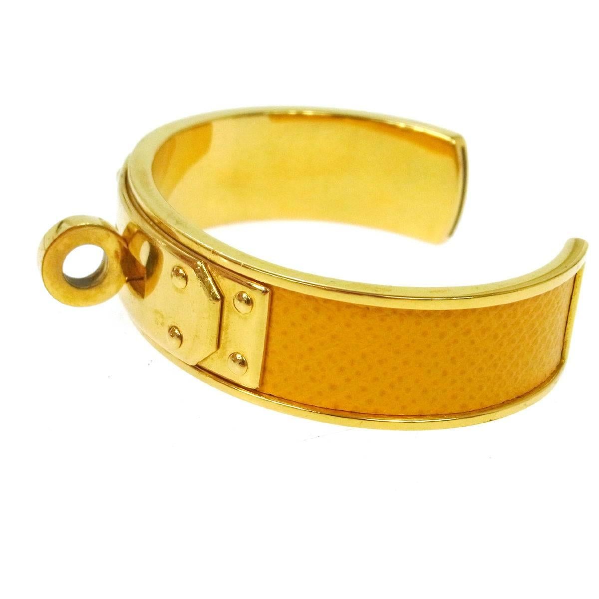 CURATOR'S NOTES

Leather
Metal
Gold tone
Slip on closure
Width 0.5"
Inner circumference ~6"

Shop Newfound Luxury for authentic Hermes cuff bracelets.