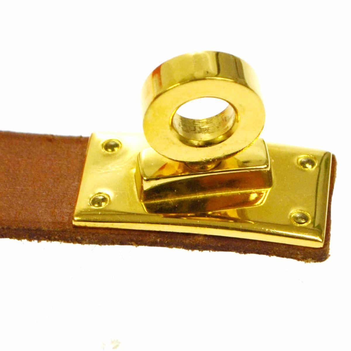 Leather
Metal
Gold tone
Twist lock closure
Width 0.75"
Inner circumference ~6.5"
Includes original Hermes box